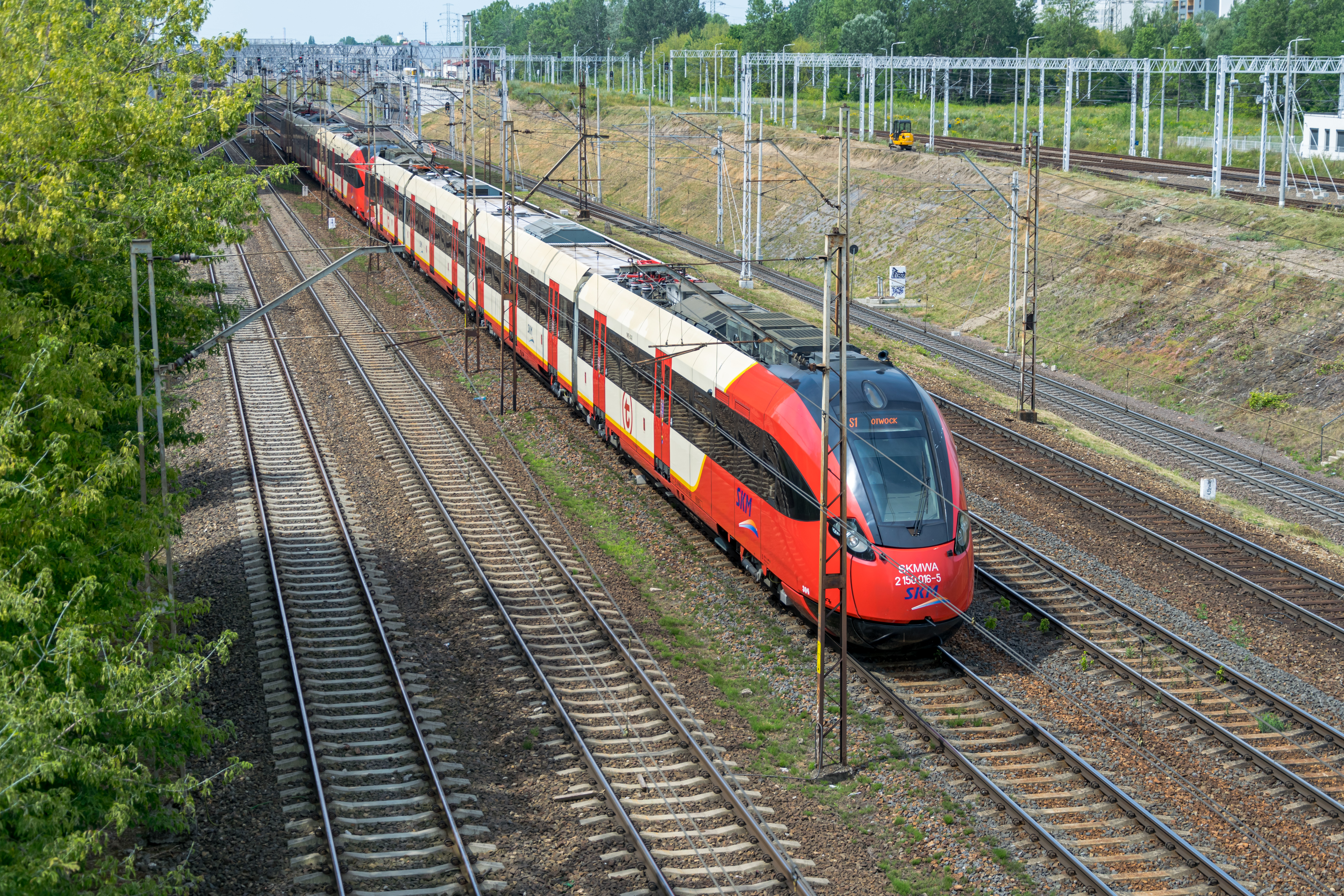 two red-cream trains coupled together