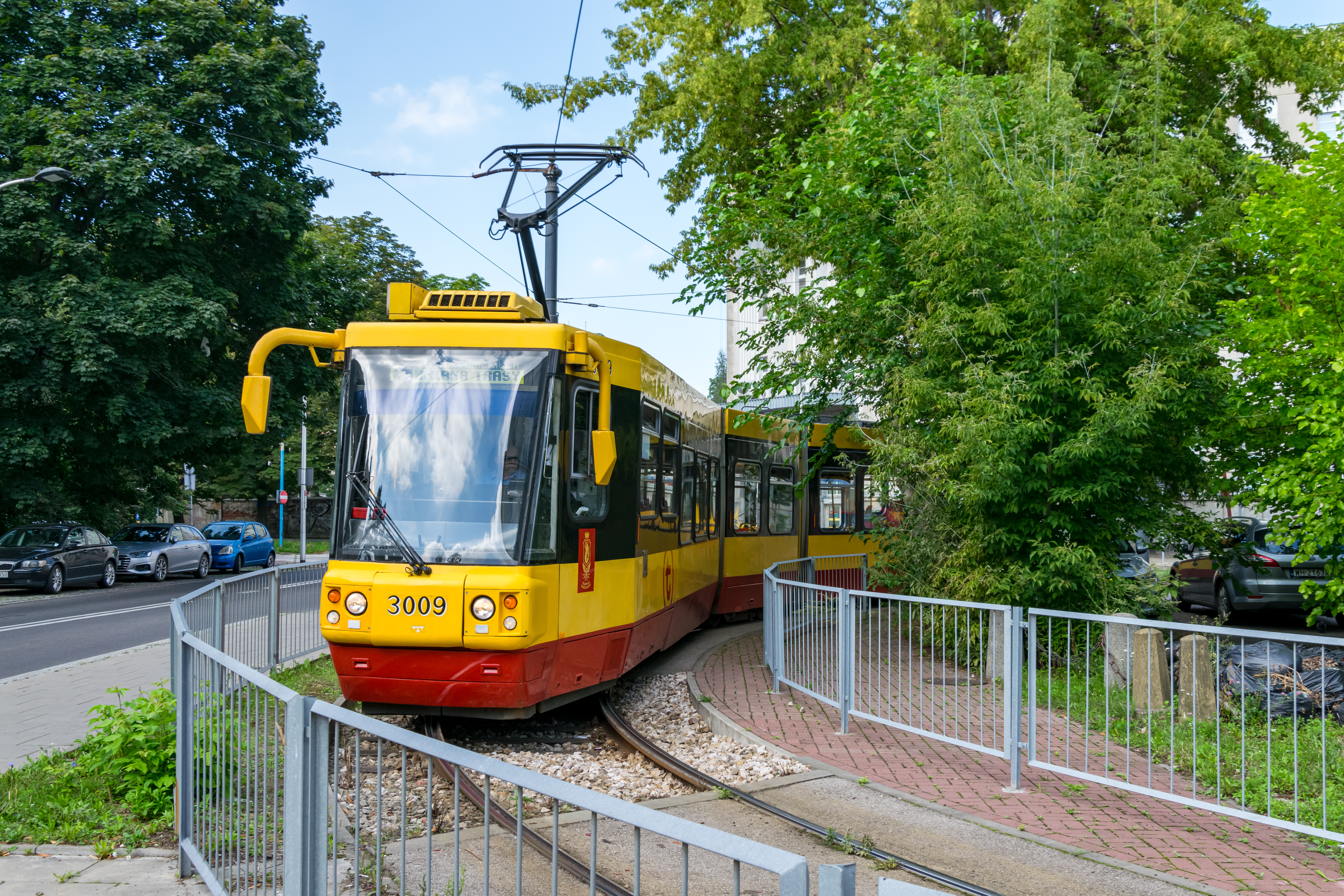 another yellow-red tram turning