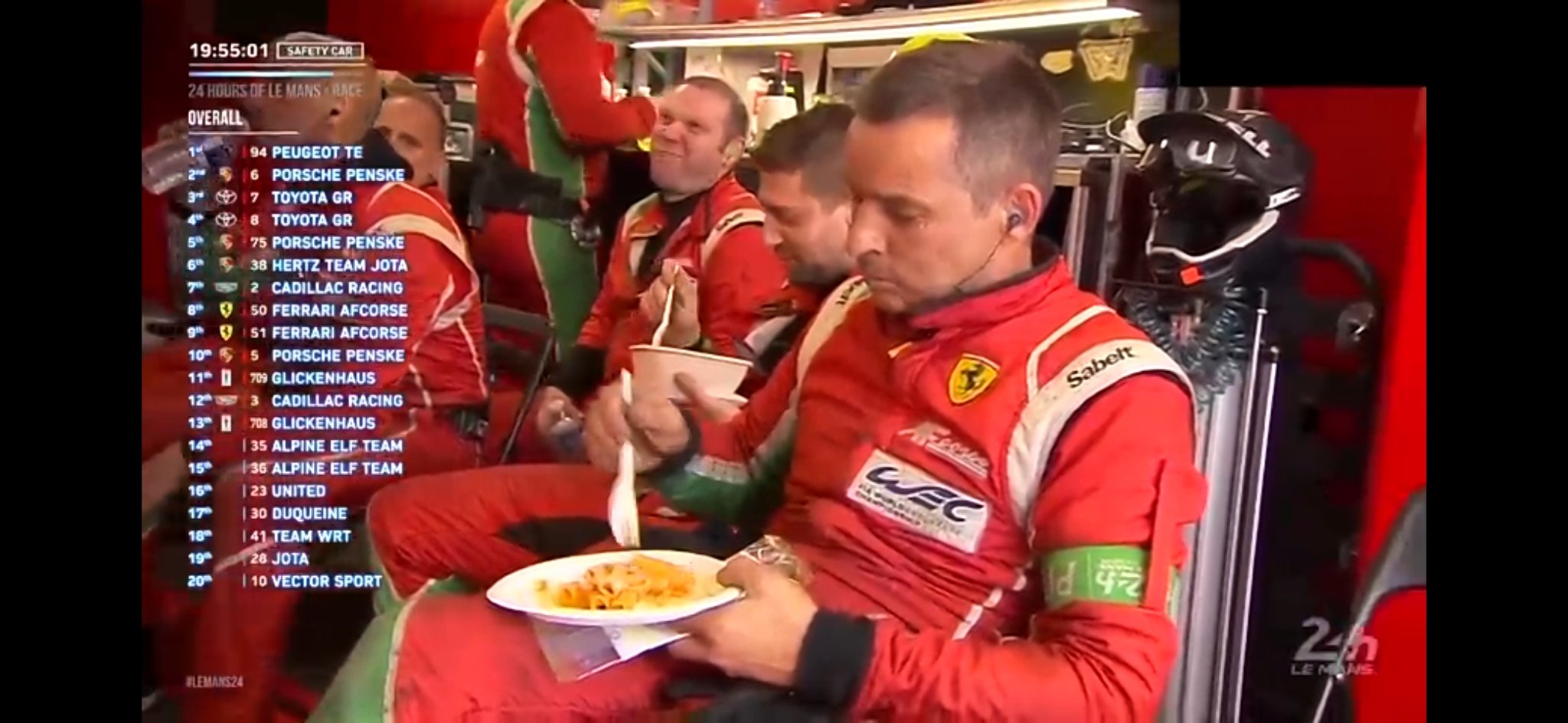 ferrari worker eating pasta in the garage