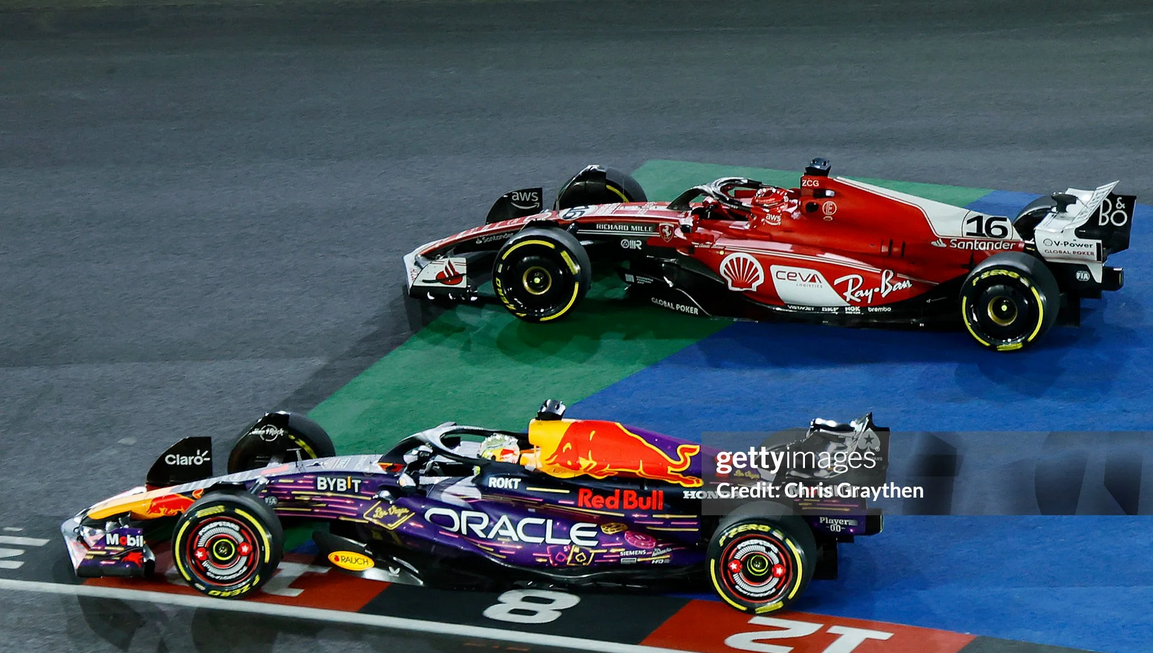 max verstappen outside the track on the inside of charles leclerc, after both left the track
