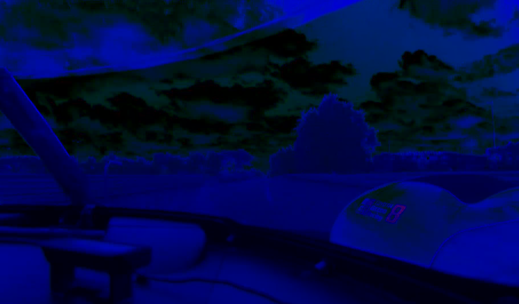 screenshot of toyota number 8 onboard with insane hue, basically half the screen is blue, other part which is the sky, is... greenish?