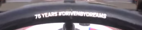 halo of a car that says hashtag driven by dreams without spaces