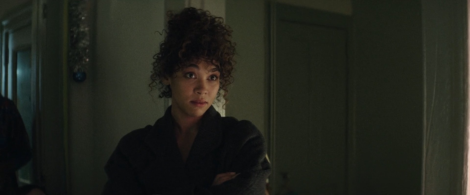 alexandra shipp is on the camera, her facial expression is something like "are you for real?"