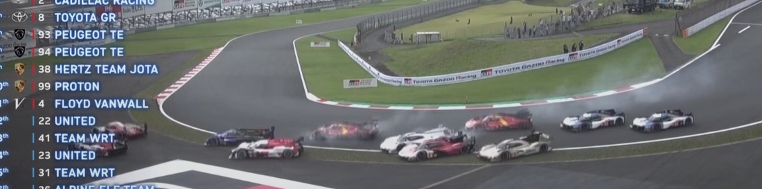 many cars in the outside grass on thr 1st turn of fuji