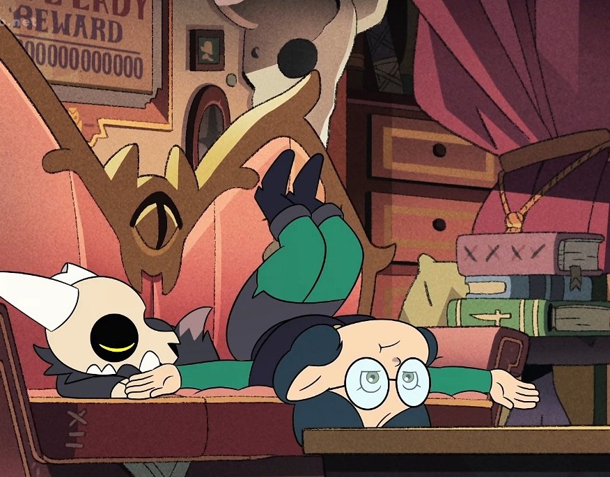 Willow from the Owl House sitting upside down with her back on the bottom of a couch and legs going up the backrest