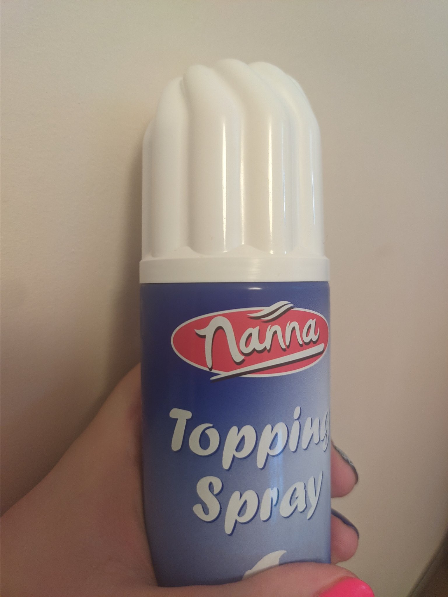 cream container with text "topping spray"
