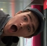 Adam from Jet Lag's face sideways, he's doing a pogchamp-style thing whereas he is clearly very excited, mouth fully open and his eyebrows are also fully raised