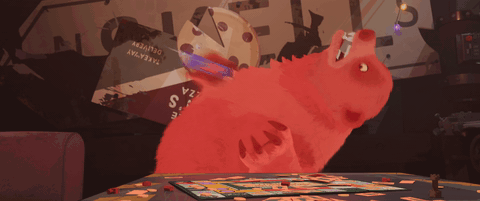 nimona falls back as a red bear, while squeezing red juice out of a small package, pretending that it's blood.