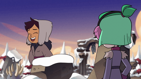 Amity has her back to us, Luz is on top of a snowy rock, facing us. she starts sliding on the snow, falling down and out of frame