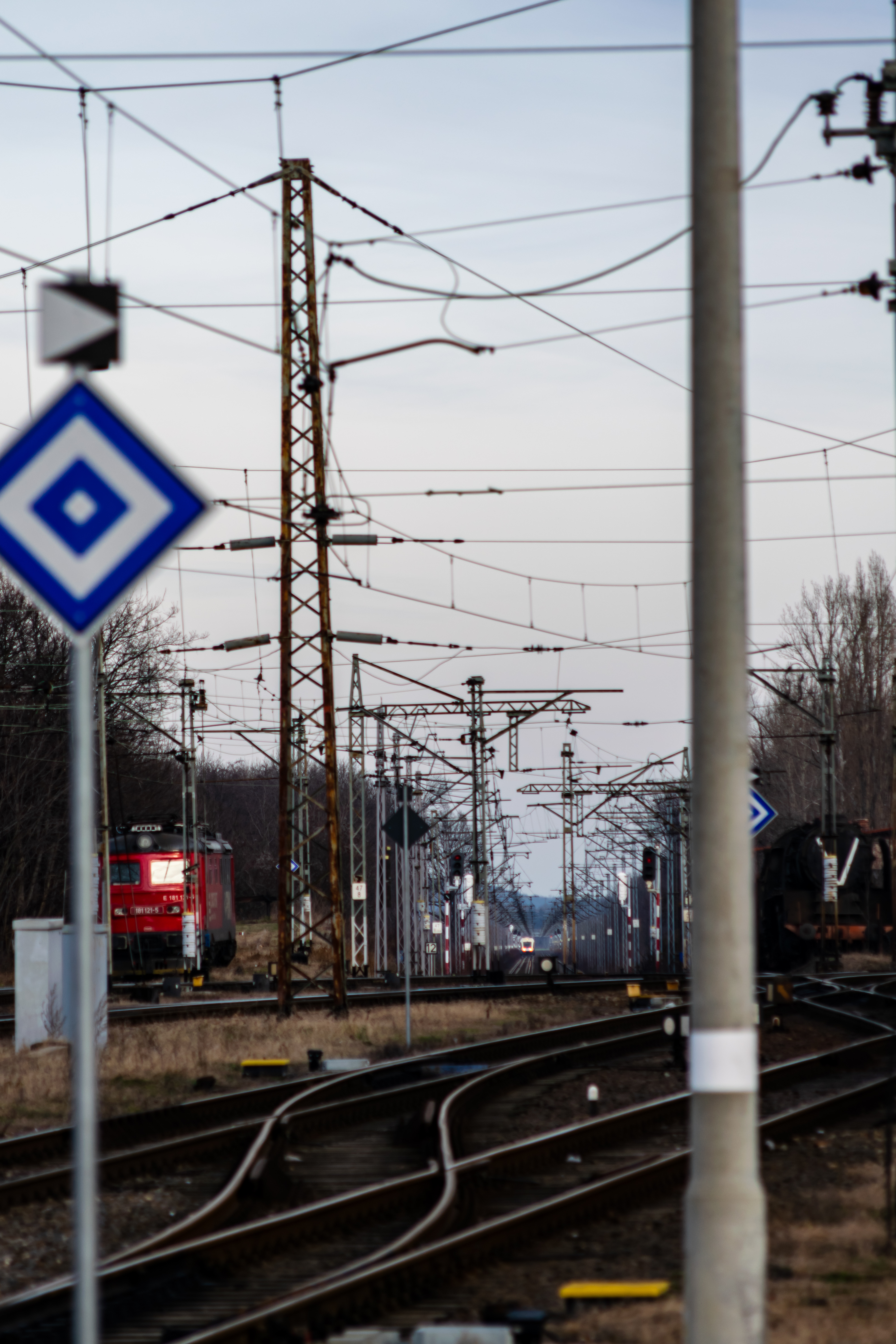 a blue-white train far away from the station