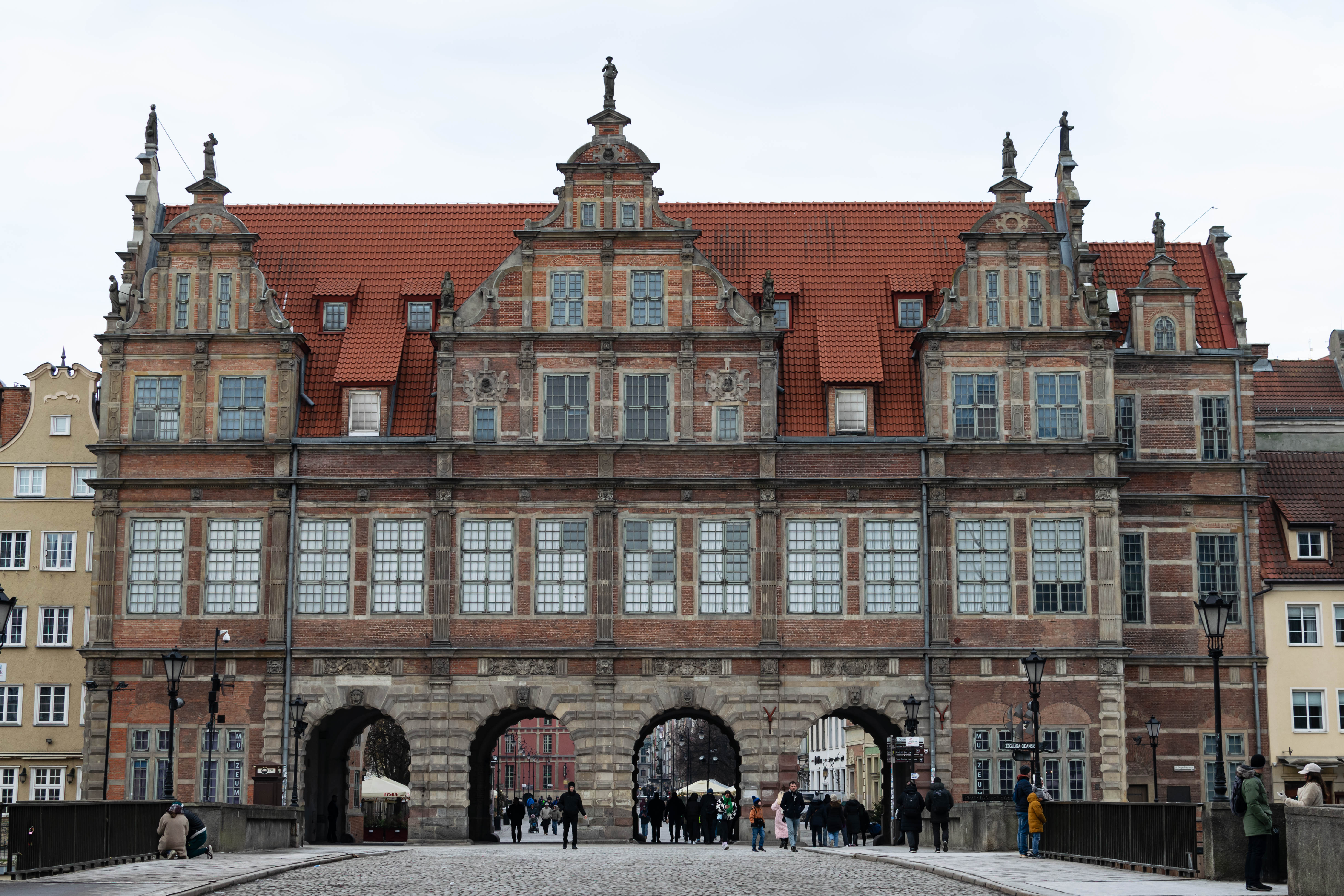grand gate building with four passages, viewed from the bridge