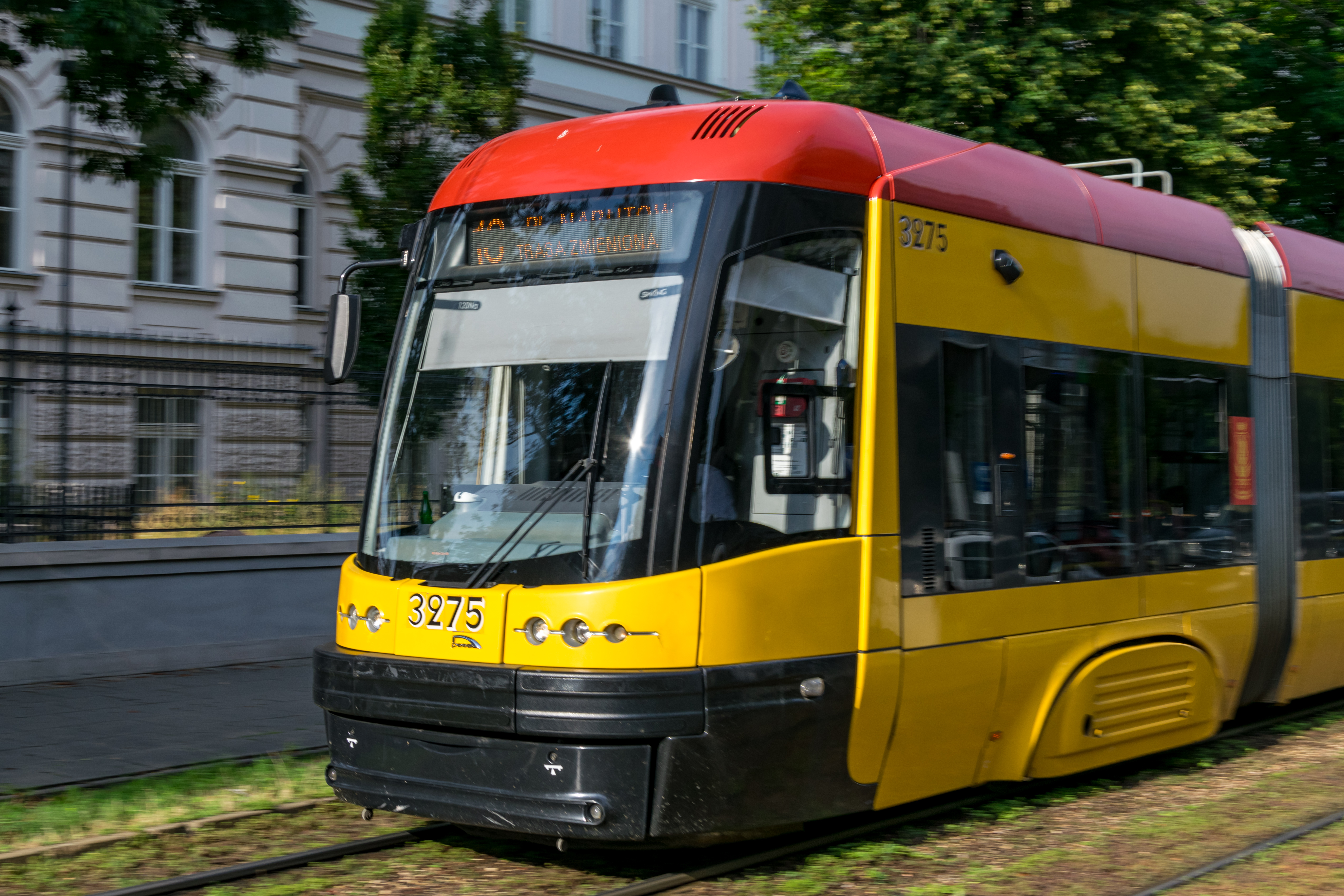 yellow-red tram doing speed