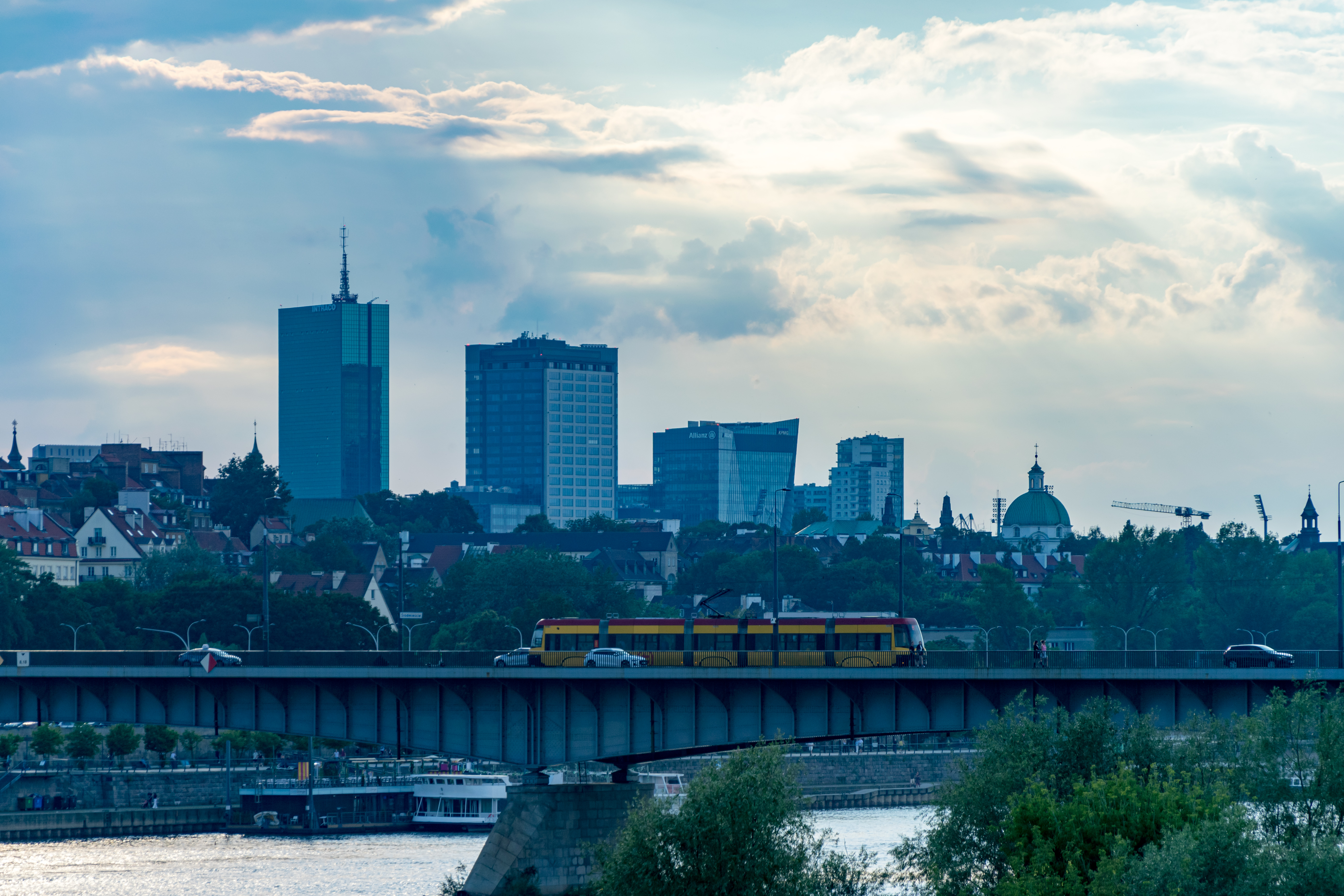 some skyscrapers and a tram