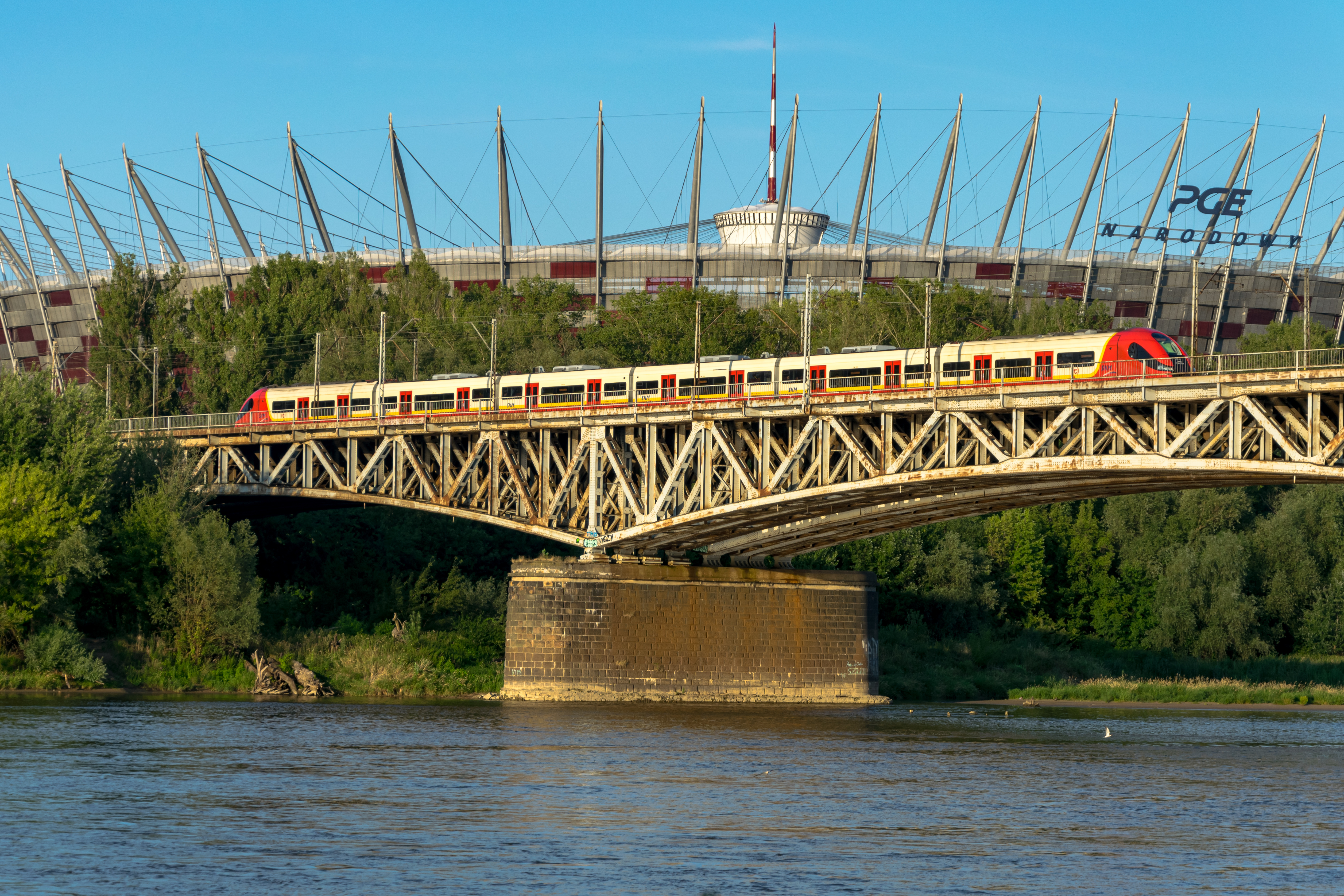 red-cream EMU on a bridge