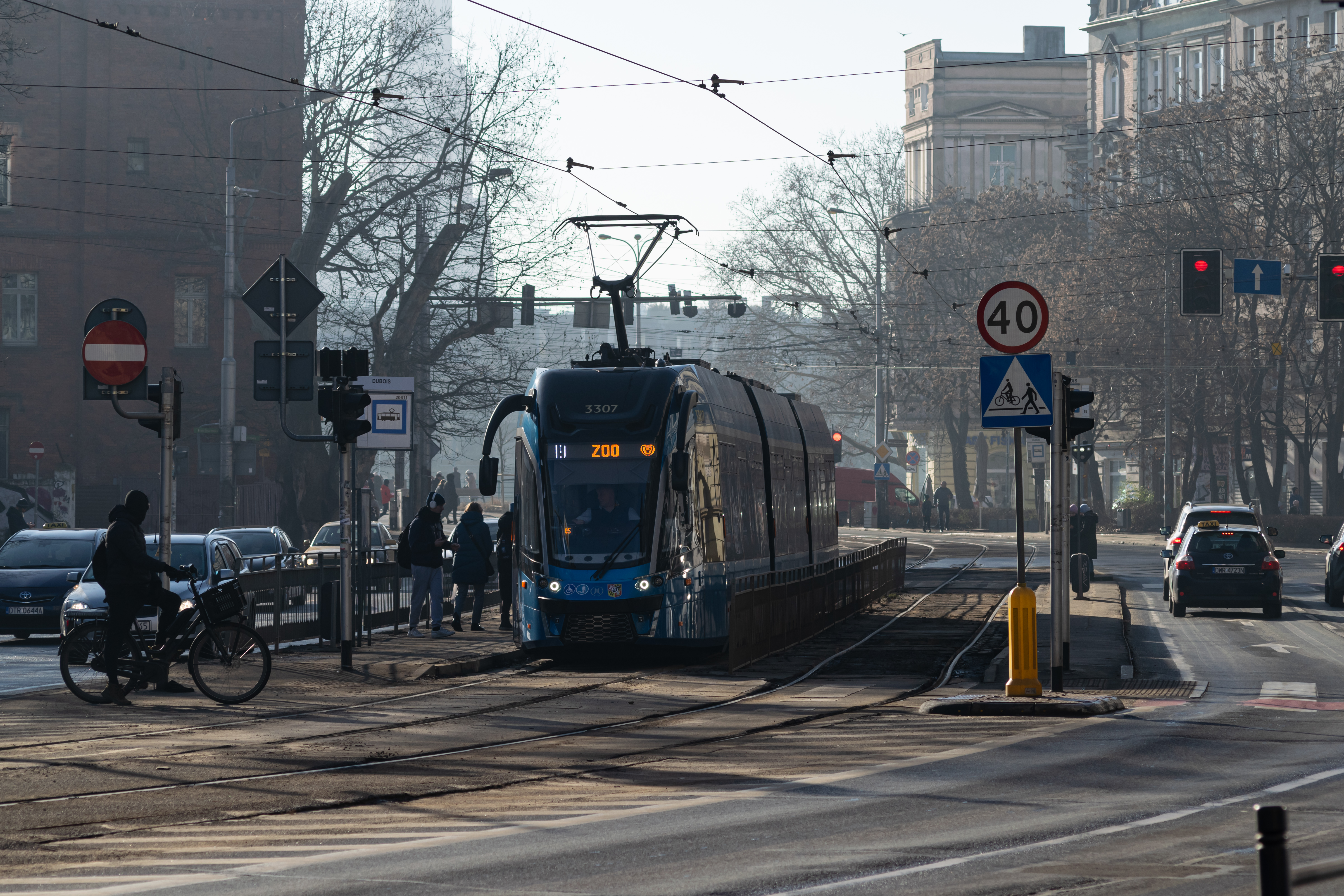 blue Moderus Gamma at a tram stop