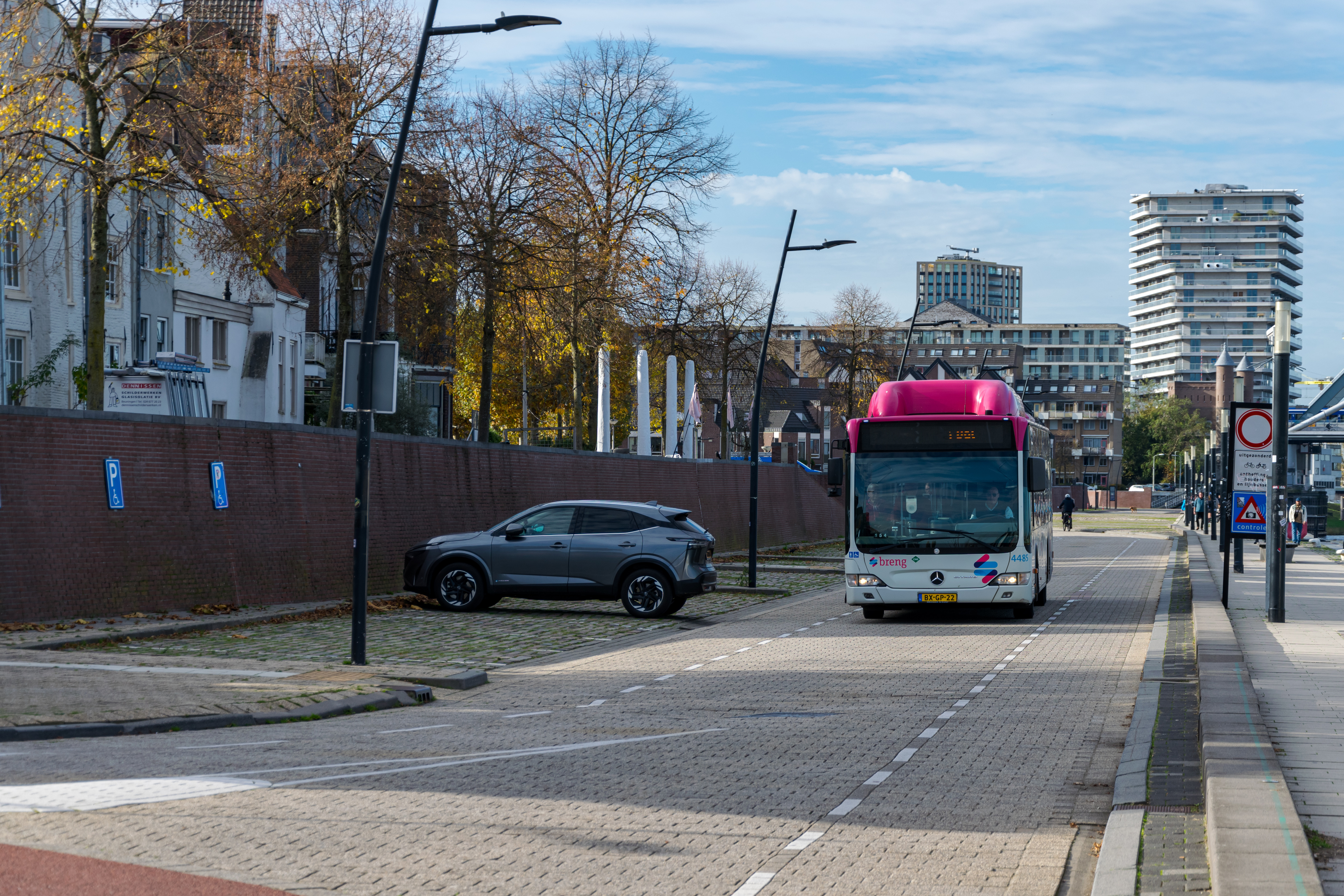 A bus next to the riverfront, was quite surprised to see not just a bus stop there, but a station of sorts, with like four stands I think?