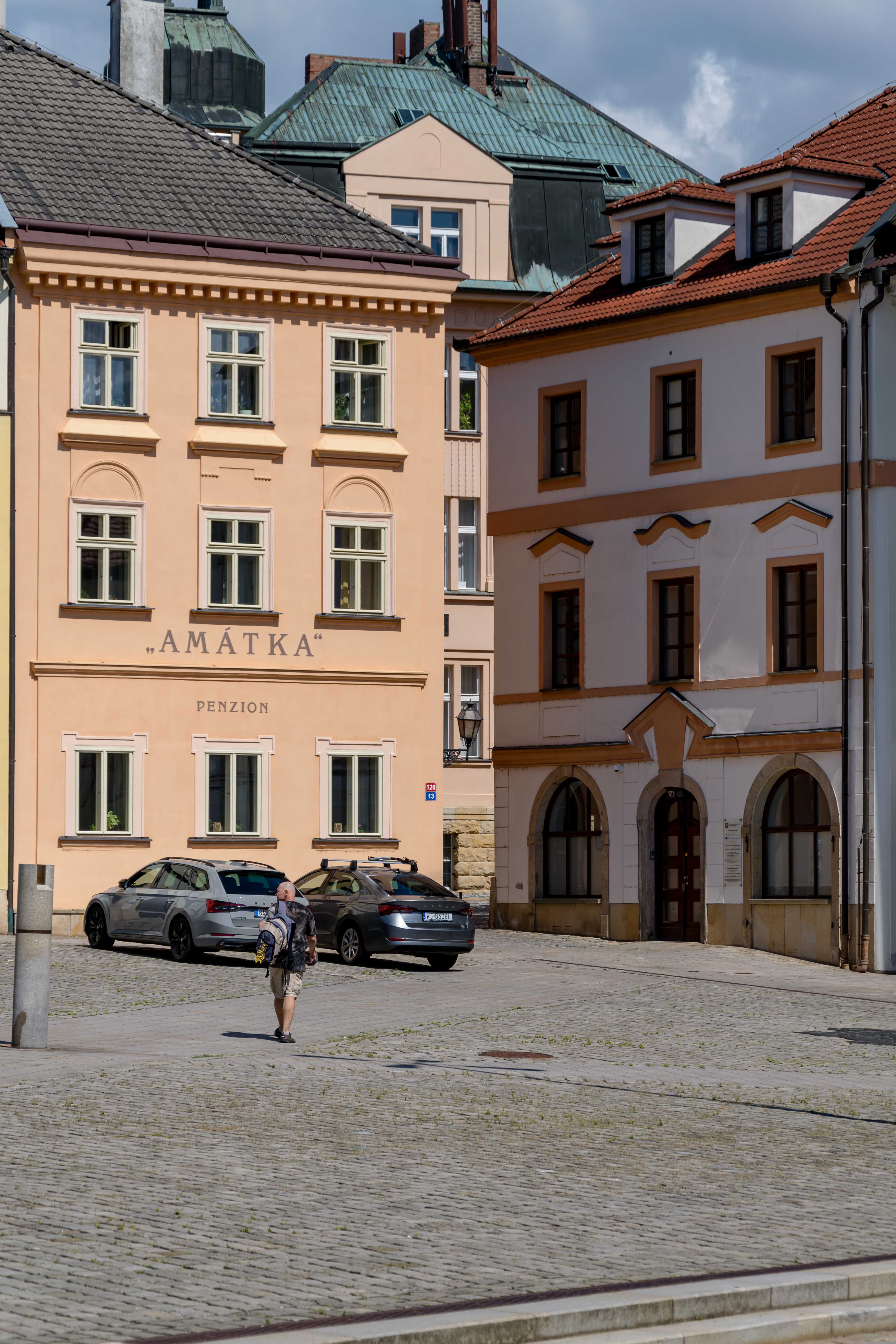 a man walking on a town square