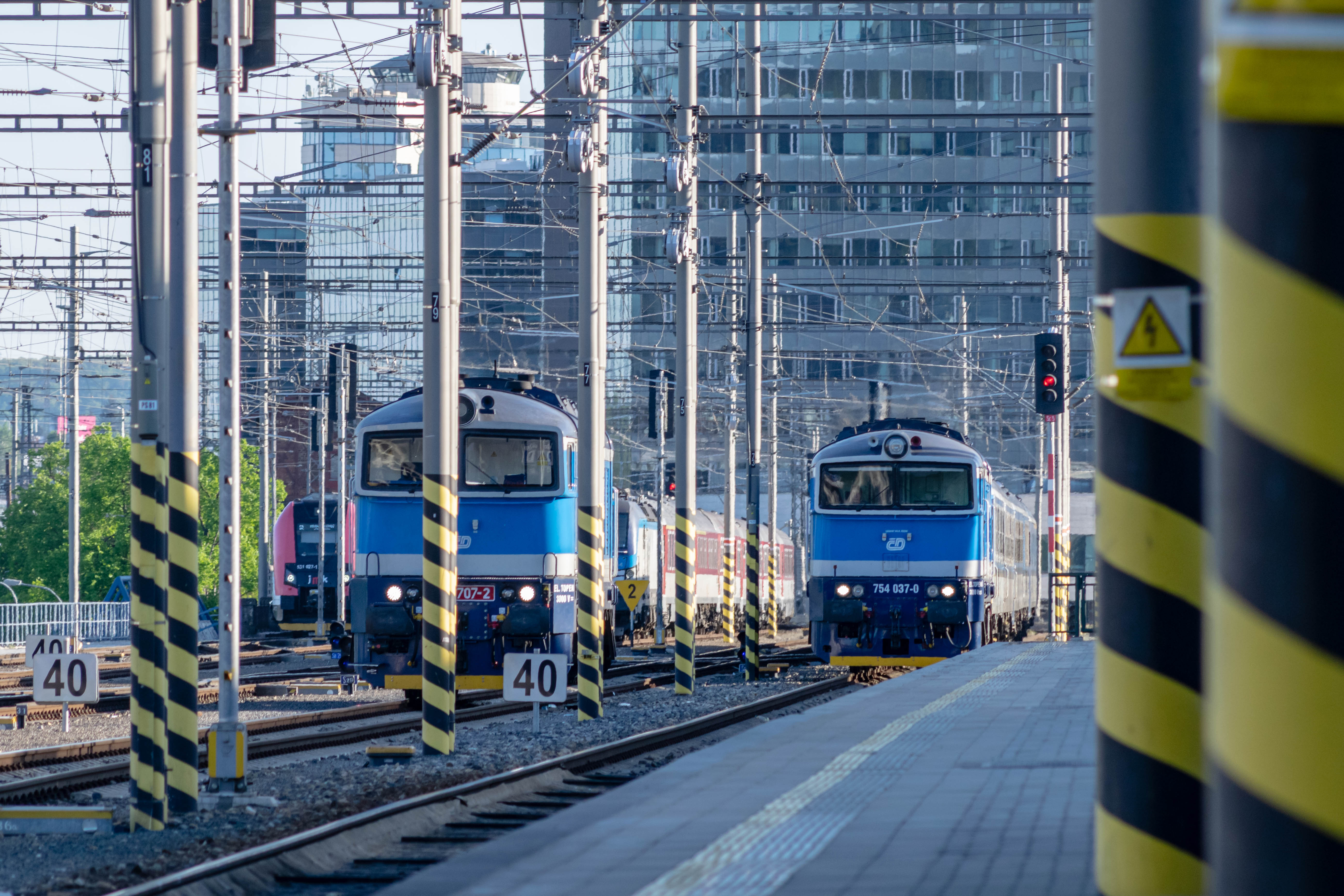 train with a diesel blue-white locomotive arriving at the platform