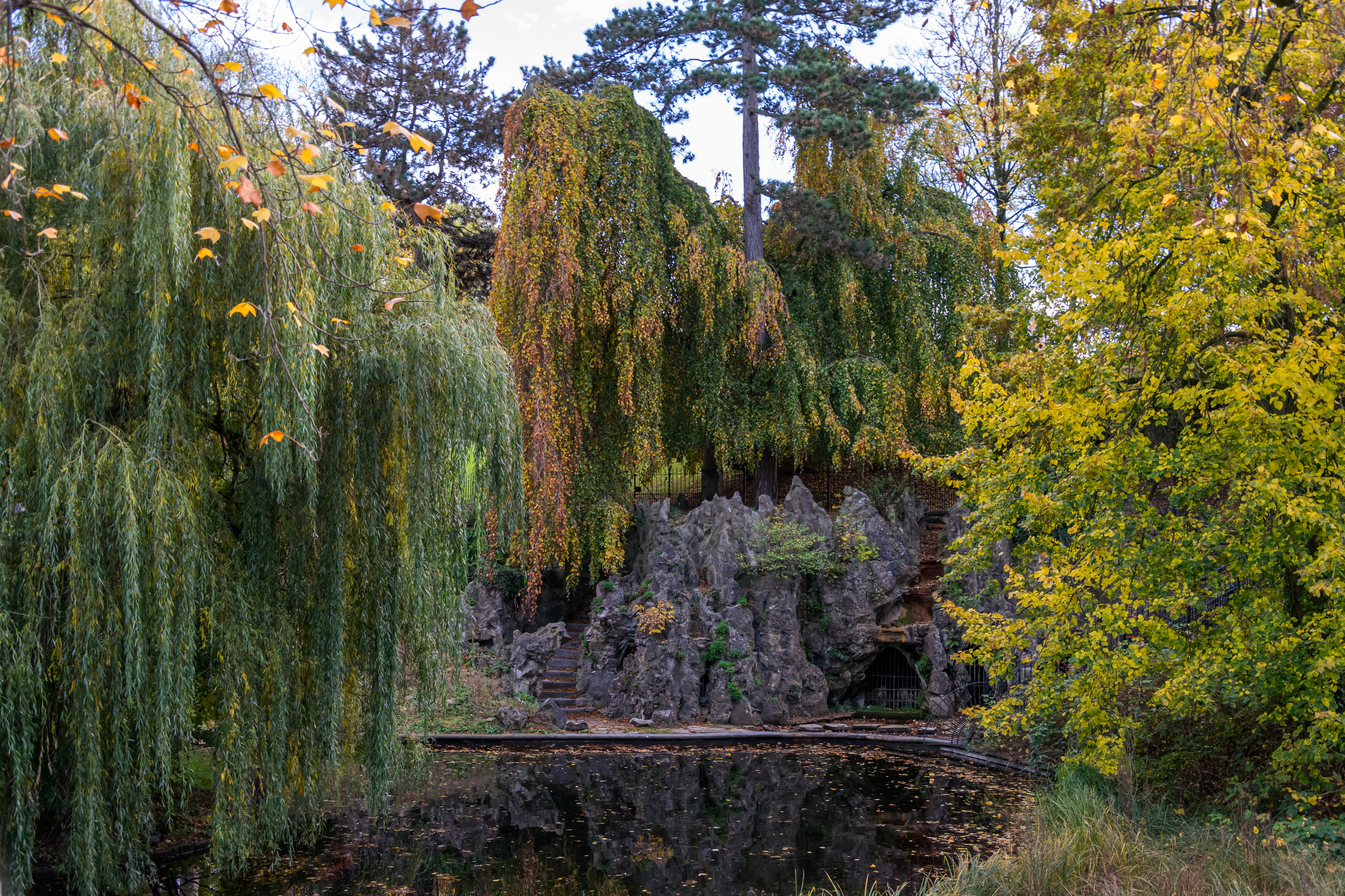 Some rocky thing over a pond