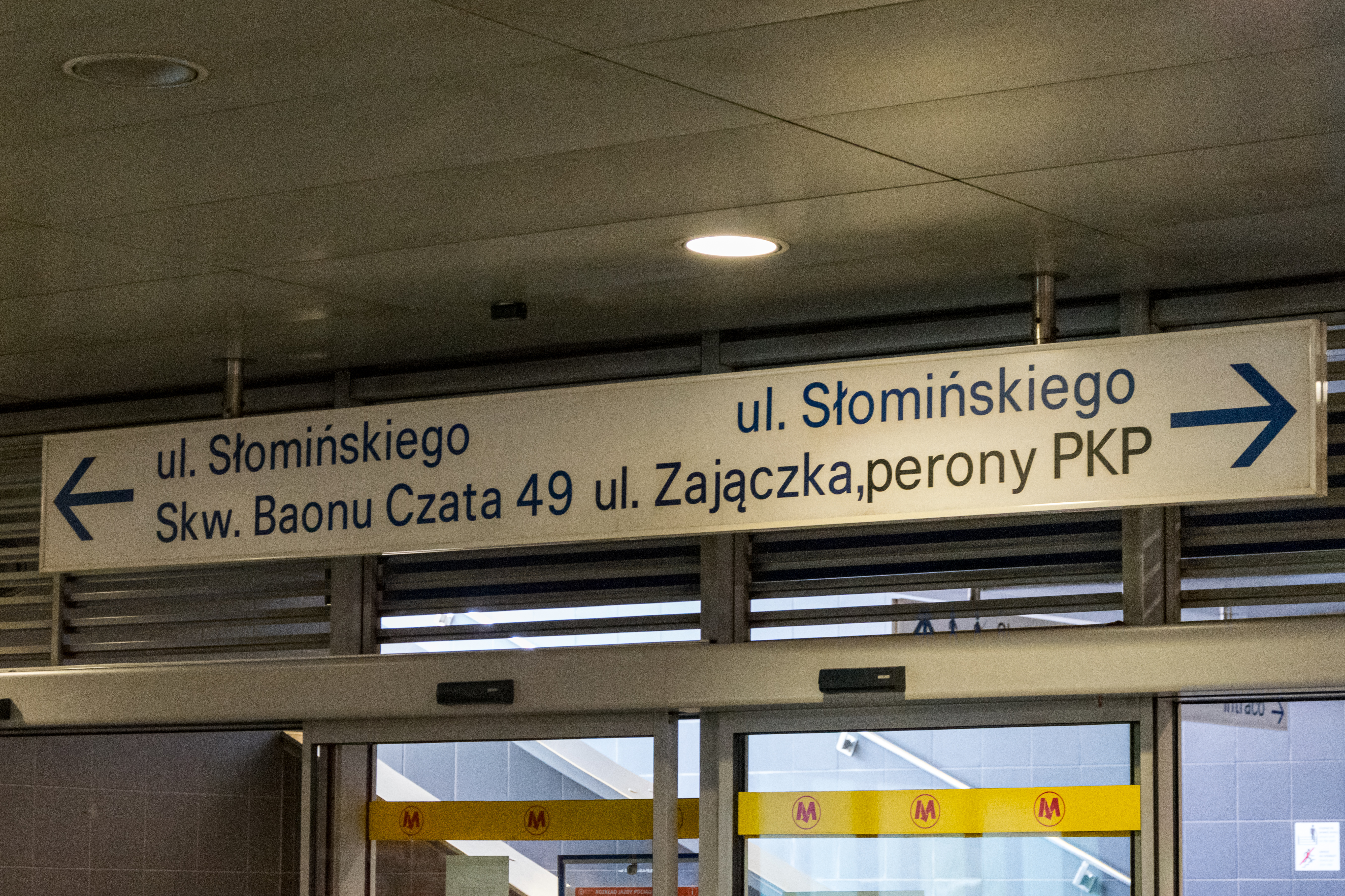 sign directing to exits in a metro station