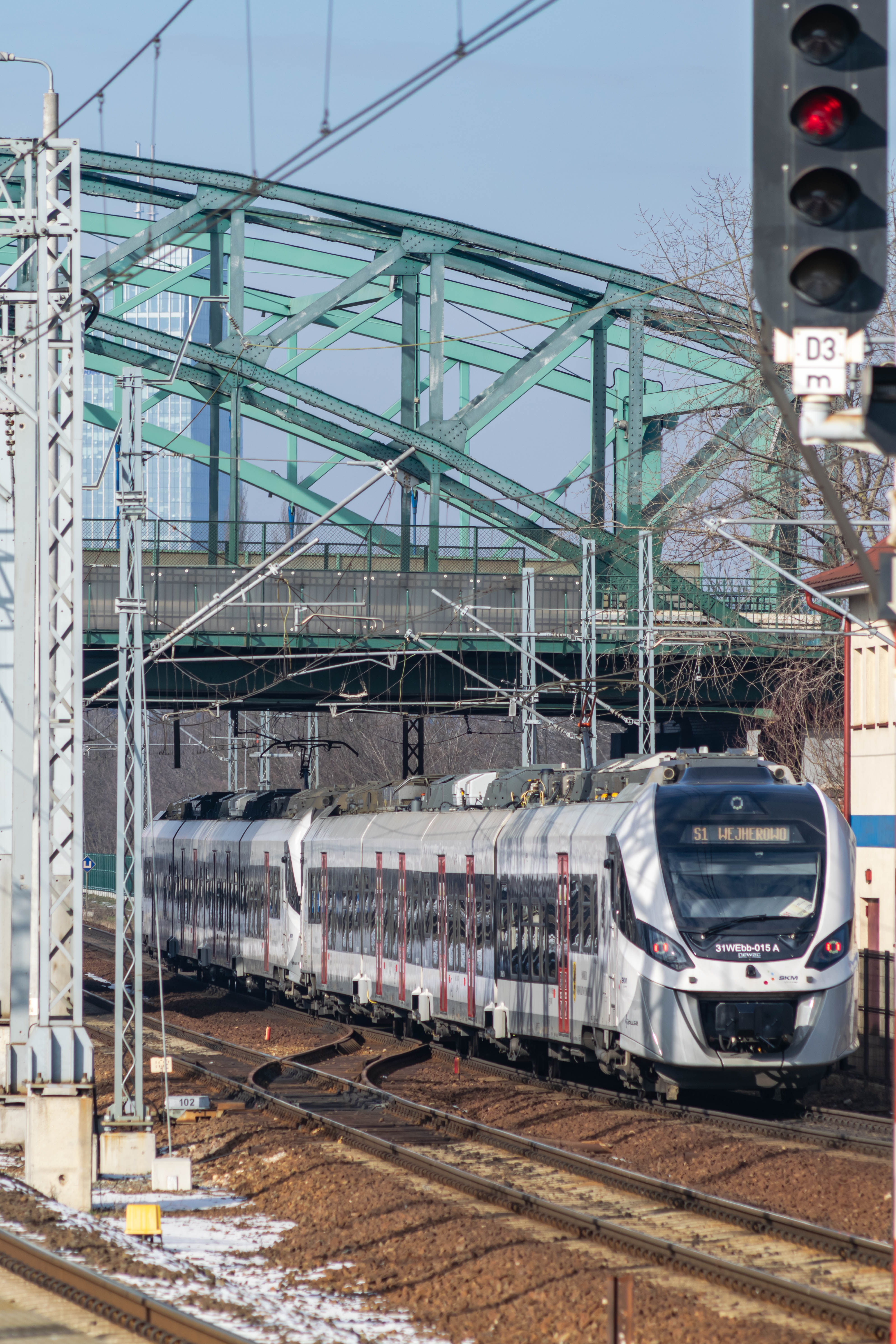 grey-black train leaving the station