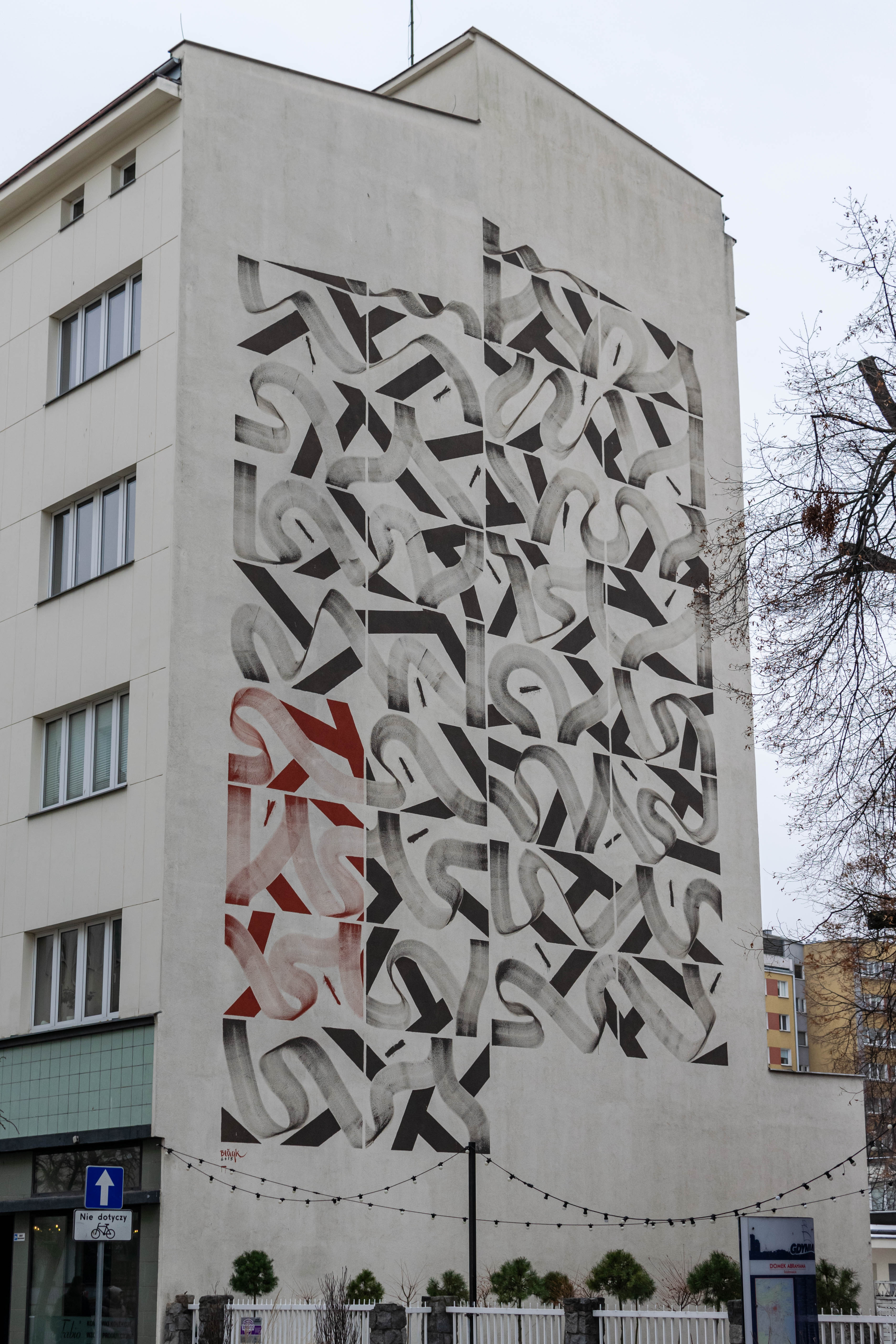 building with a mural depicting... something...? i guess...? it's a bunch of squiggly lines