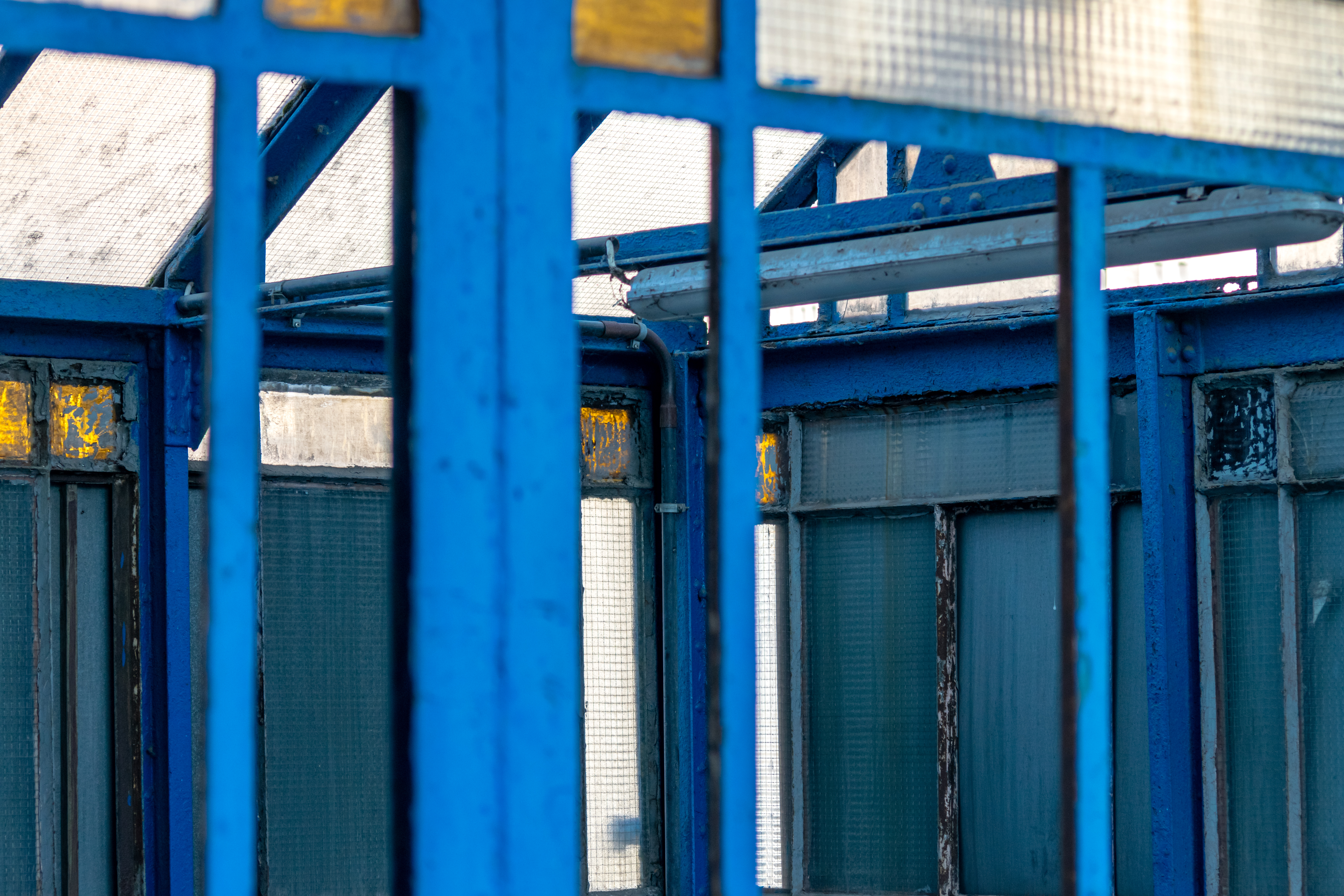 blue skeleton of a Thing, with missing glass panes