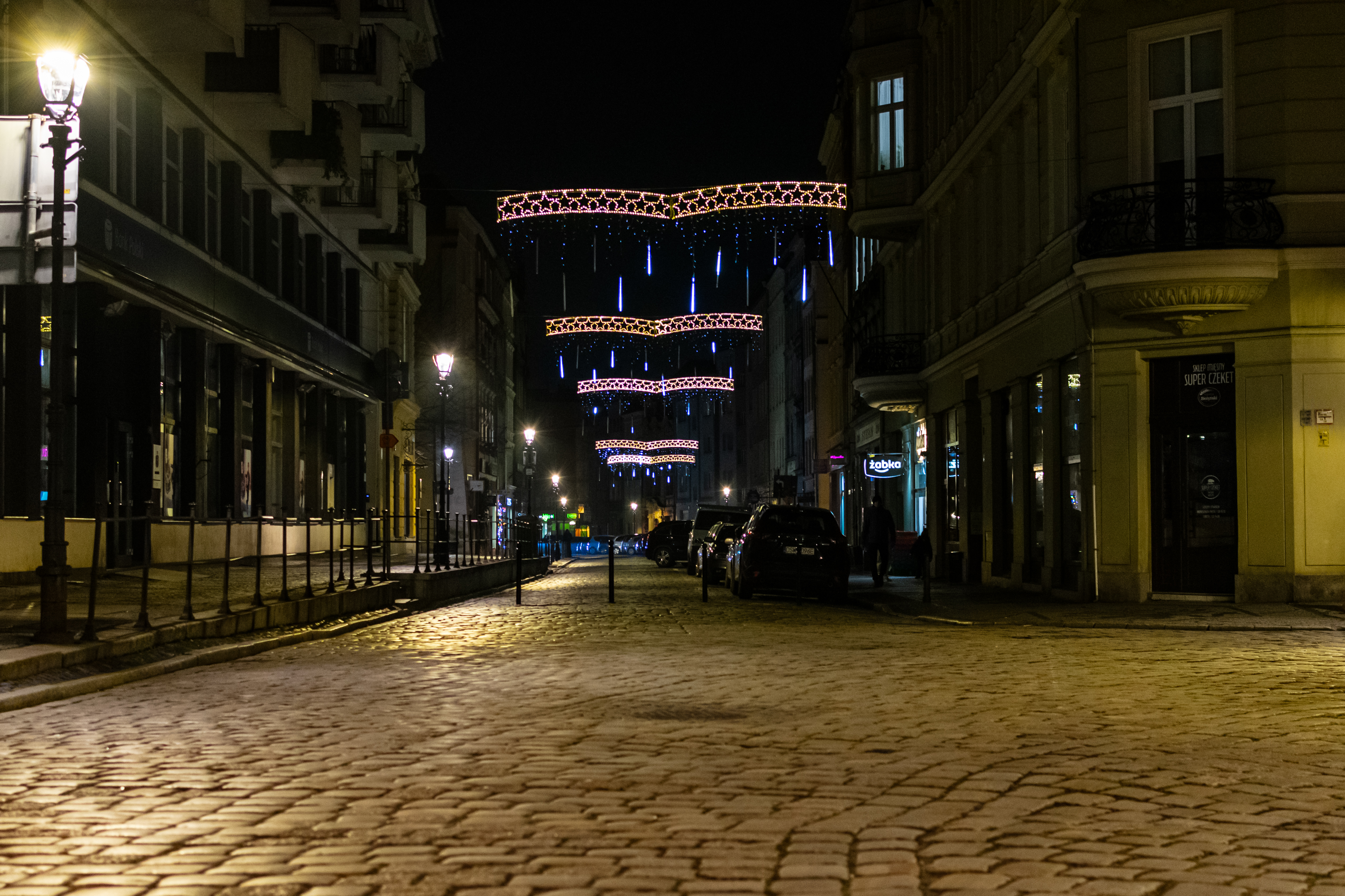 a street with various christmas decorations