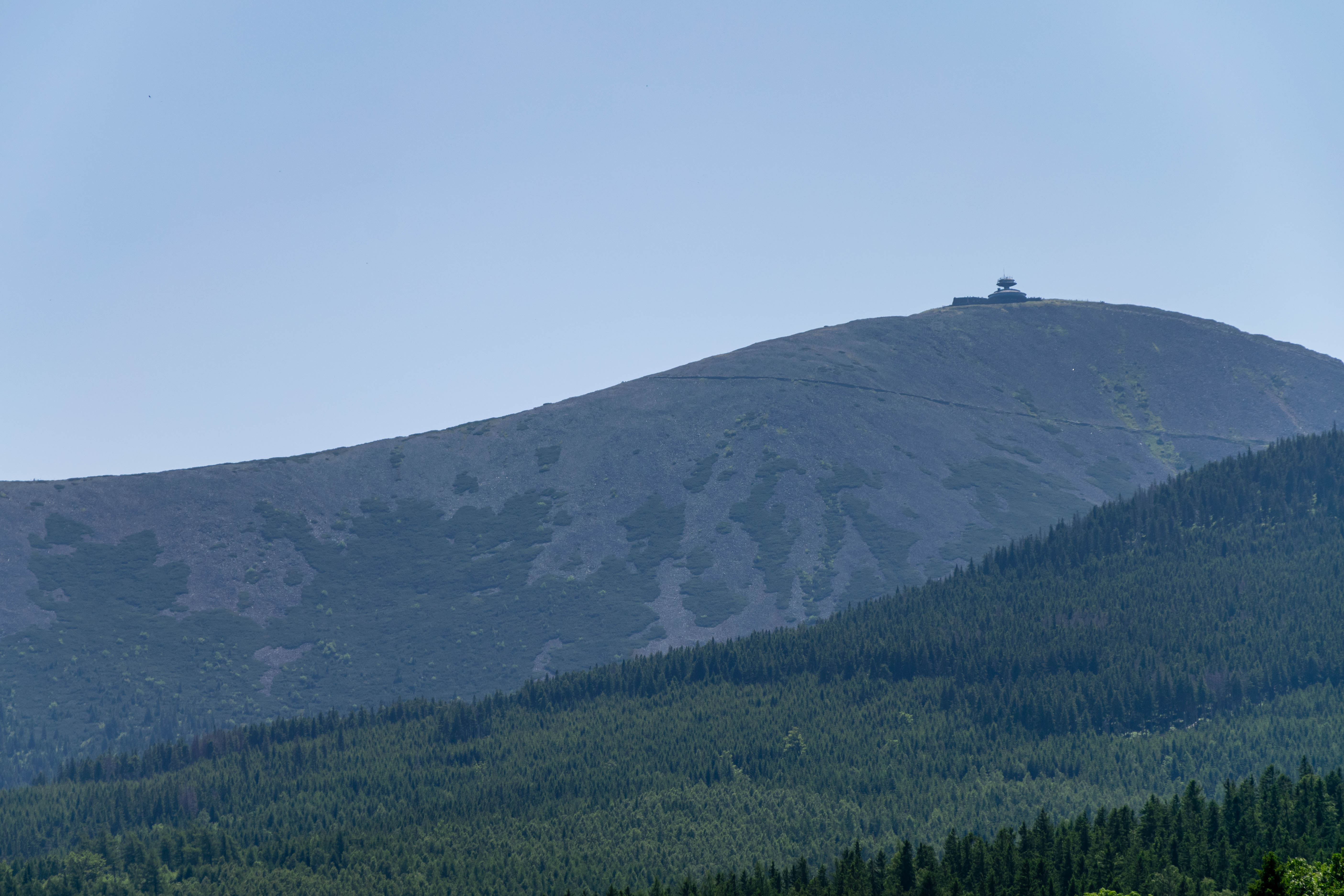 mountain with an observatory thing on top, amount of trees is lessening with altitude