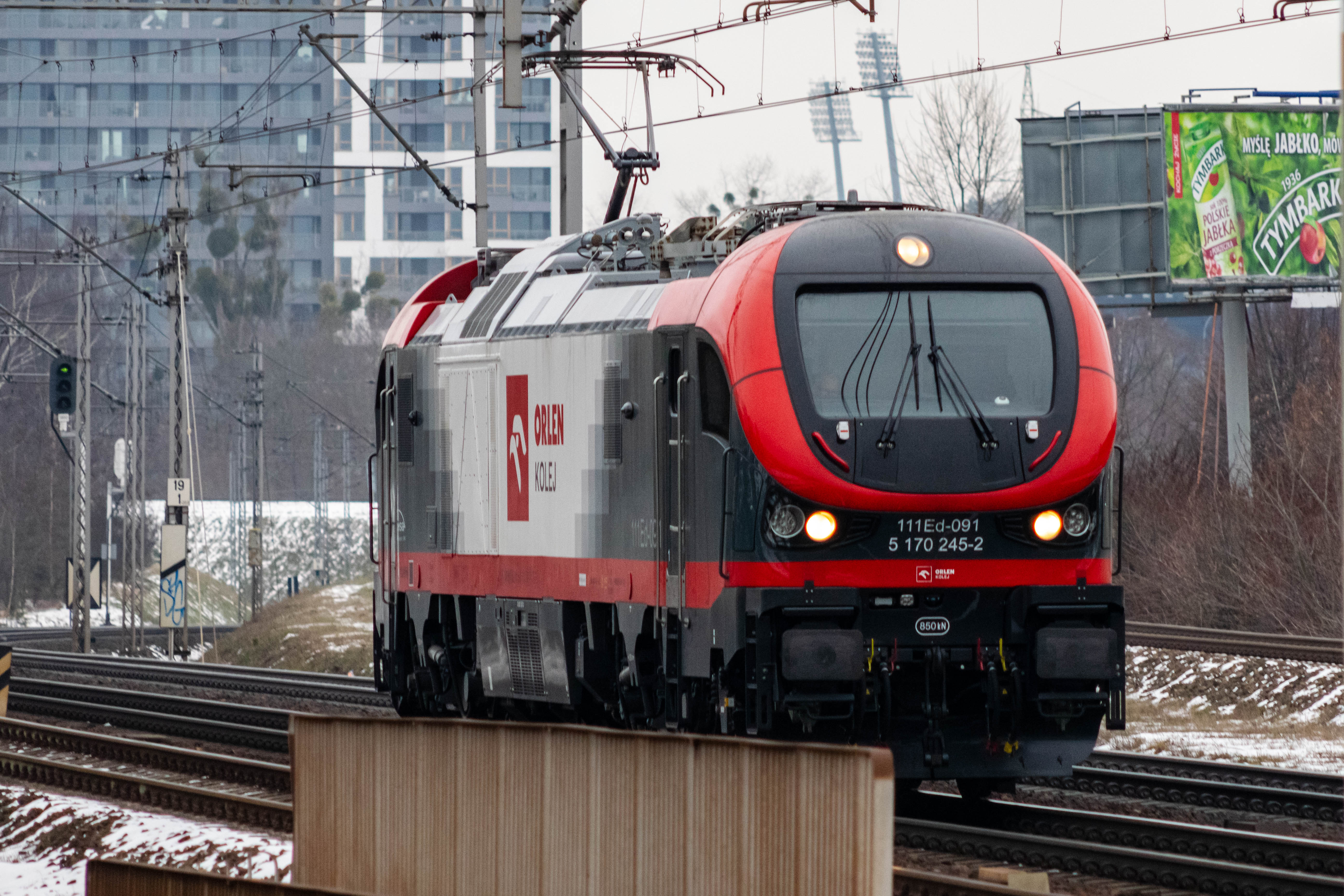 red-black-white locomotive just going