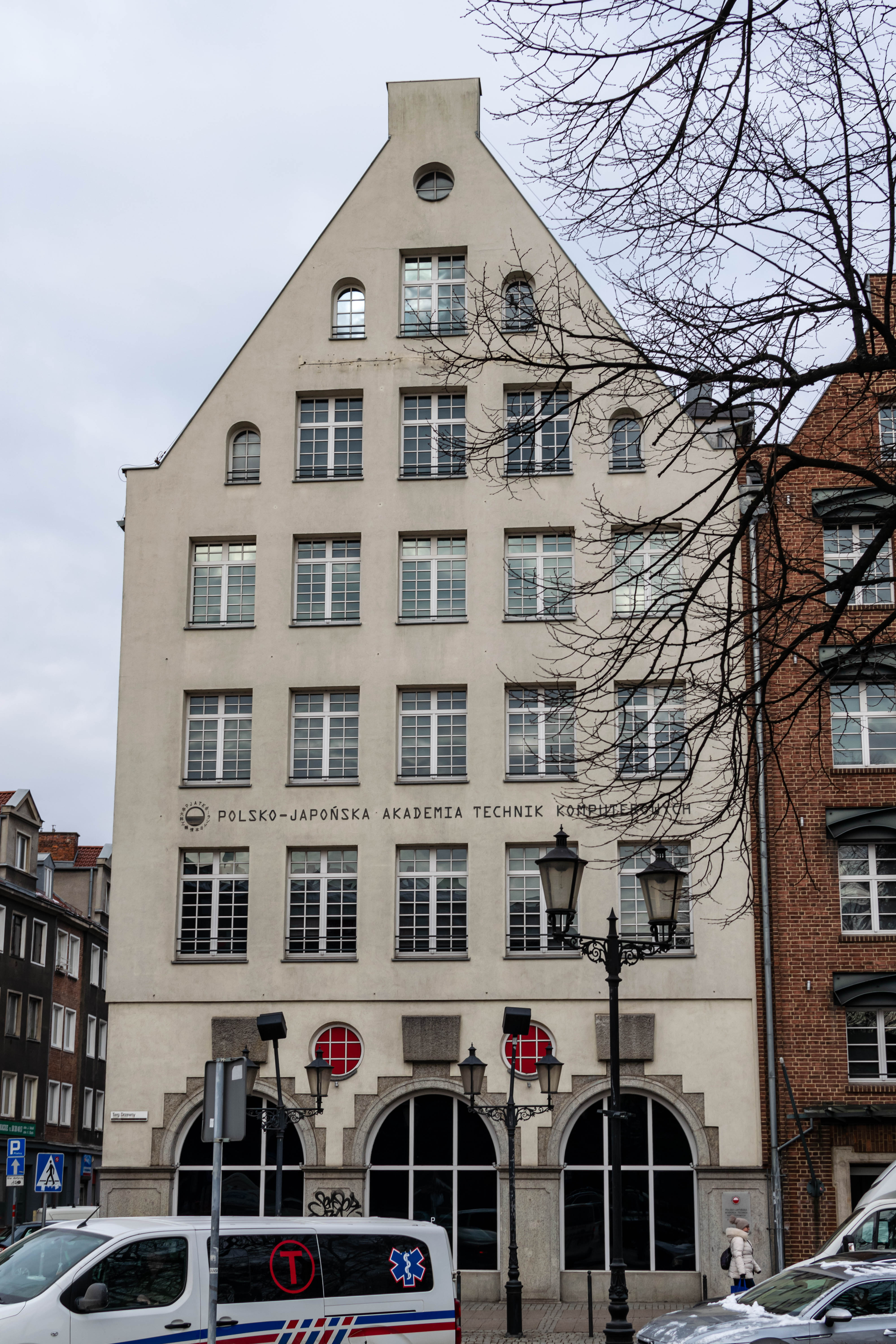 townhouse of owned by "Polish-Japanese Academy of Information Technology", it's beige
