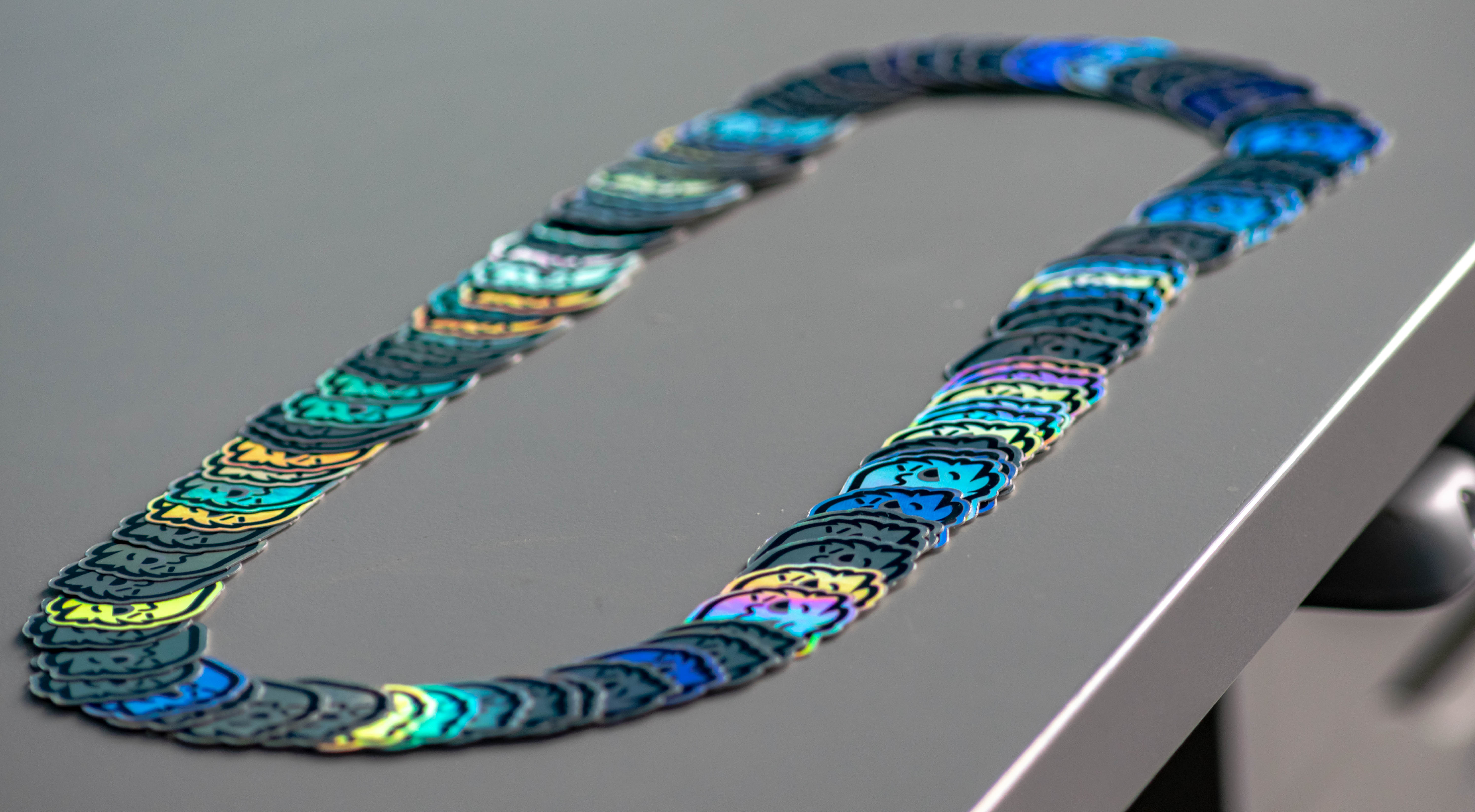 lots of holographic emote stickers arranged in an oval