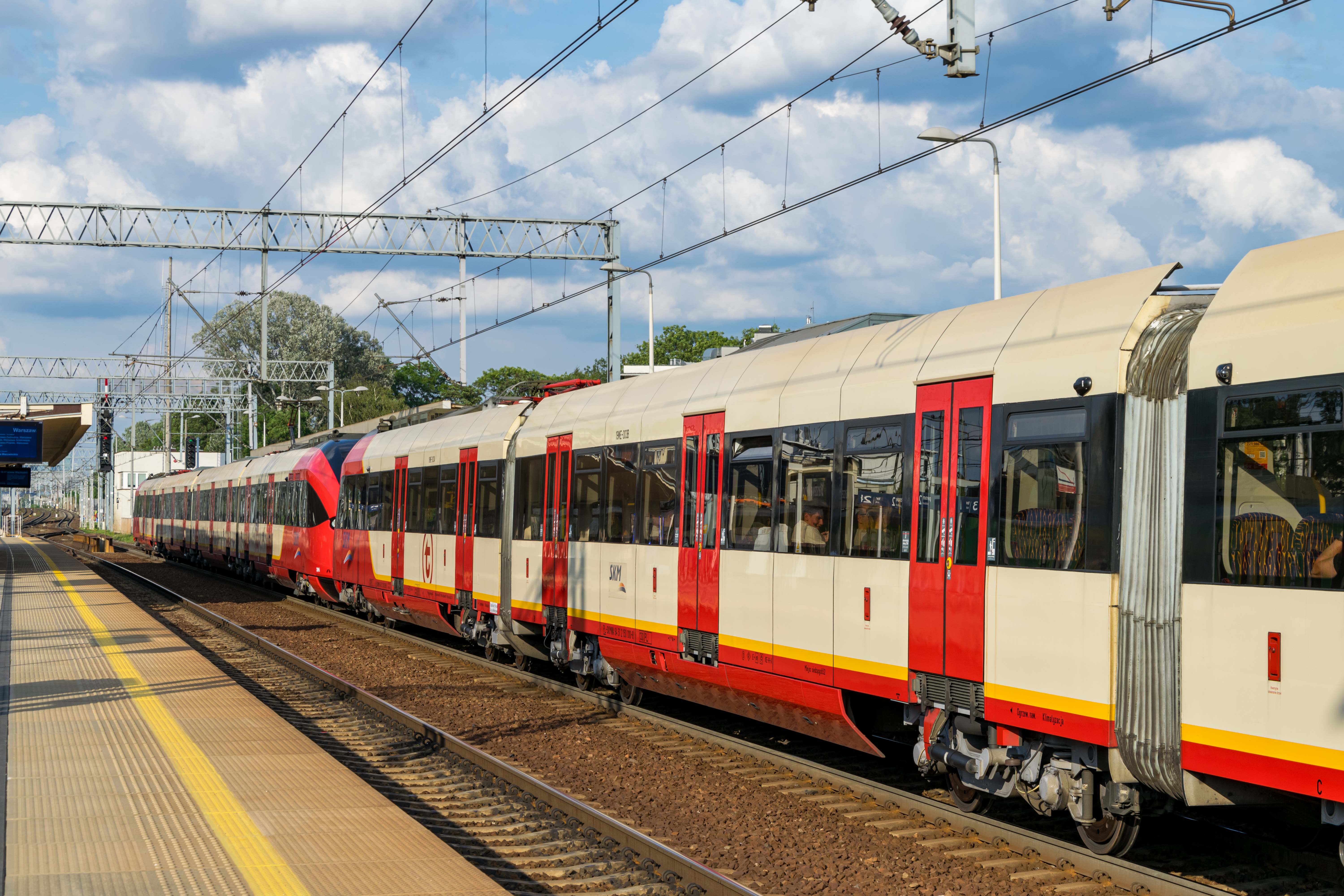 two coupled red-cream EMUs