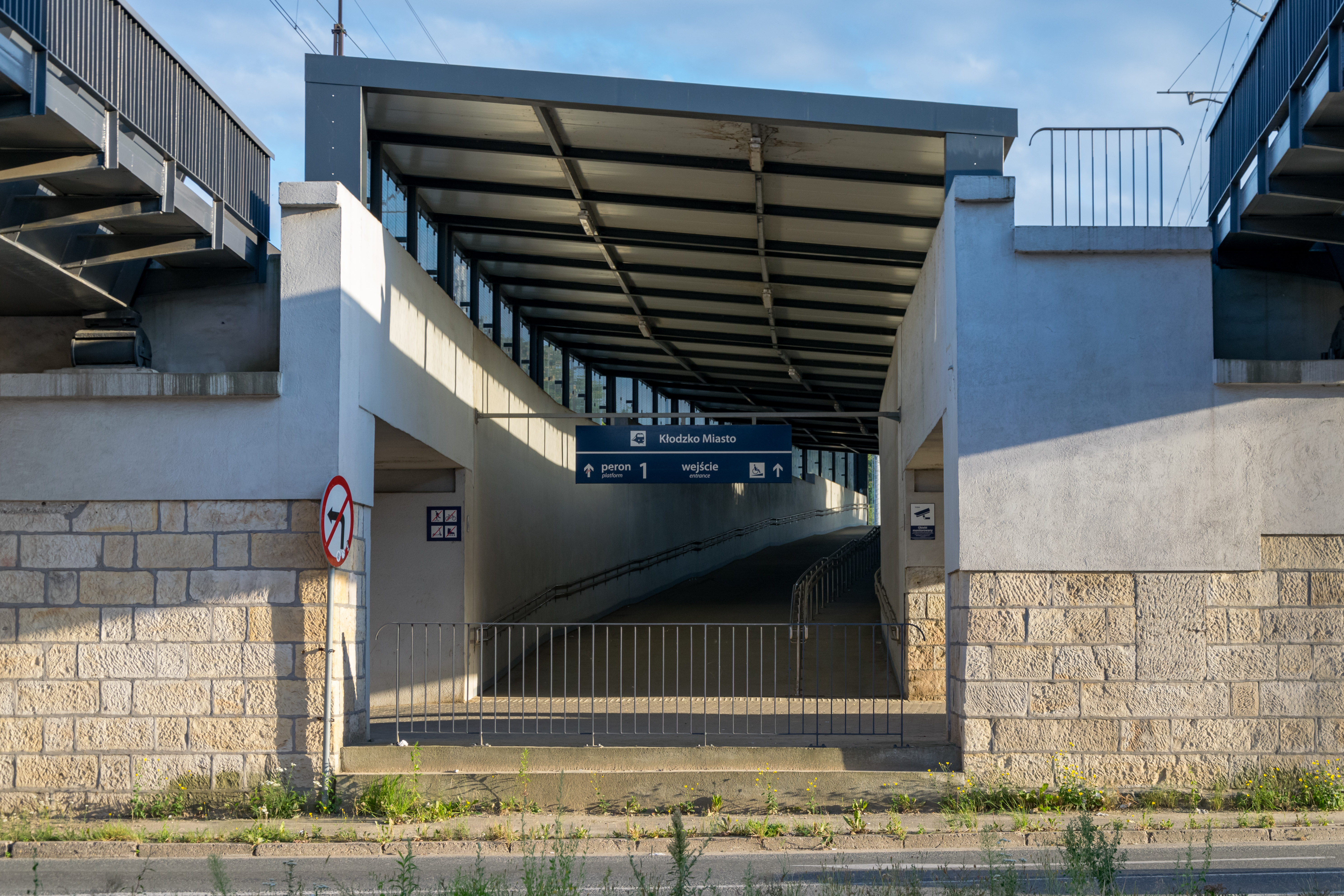train station entrance which really is just a ramp going up to a platform 1