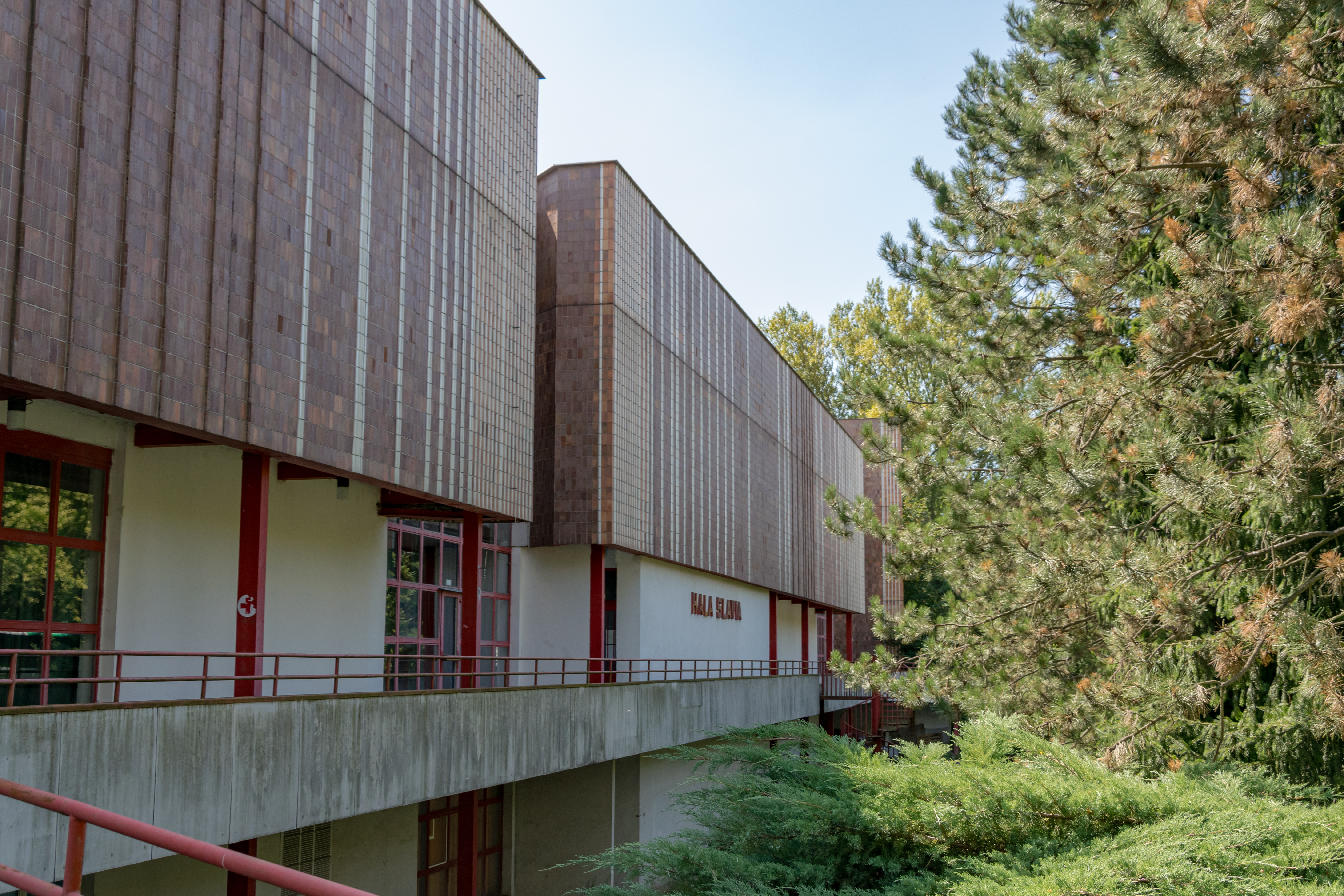 modernist sports hall with extensive brown tiling
