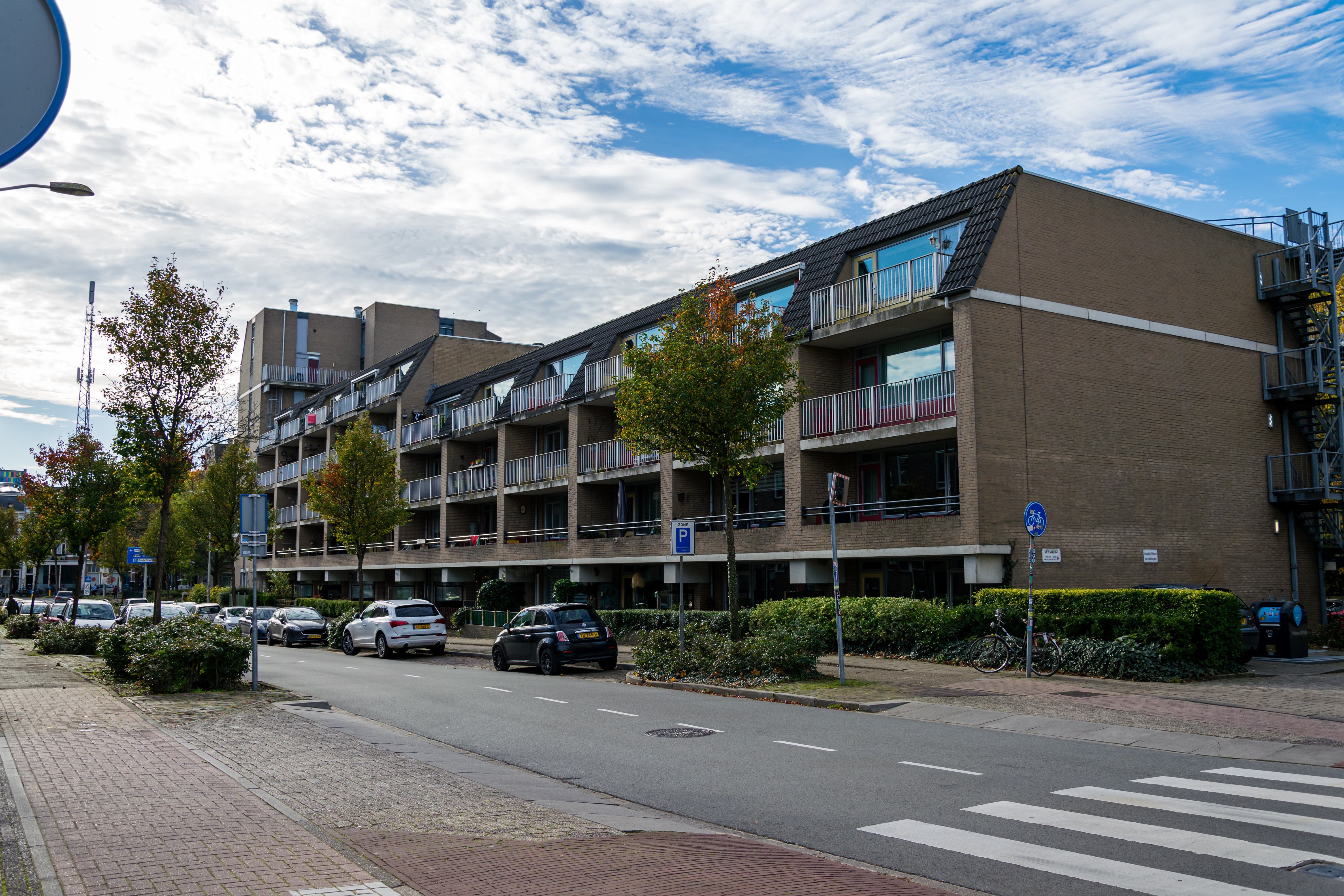 residential block, last floor balconies have a slated roof thing going on, but otherwise it looks like a spruced up commie block