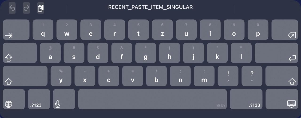 ios on screen keyboard prominently displaying “RECENT_PASTE_ITEM_SINGULAR” instead of a localized version