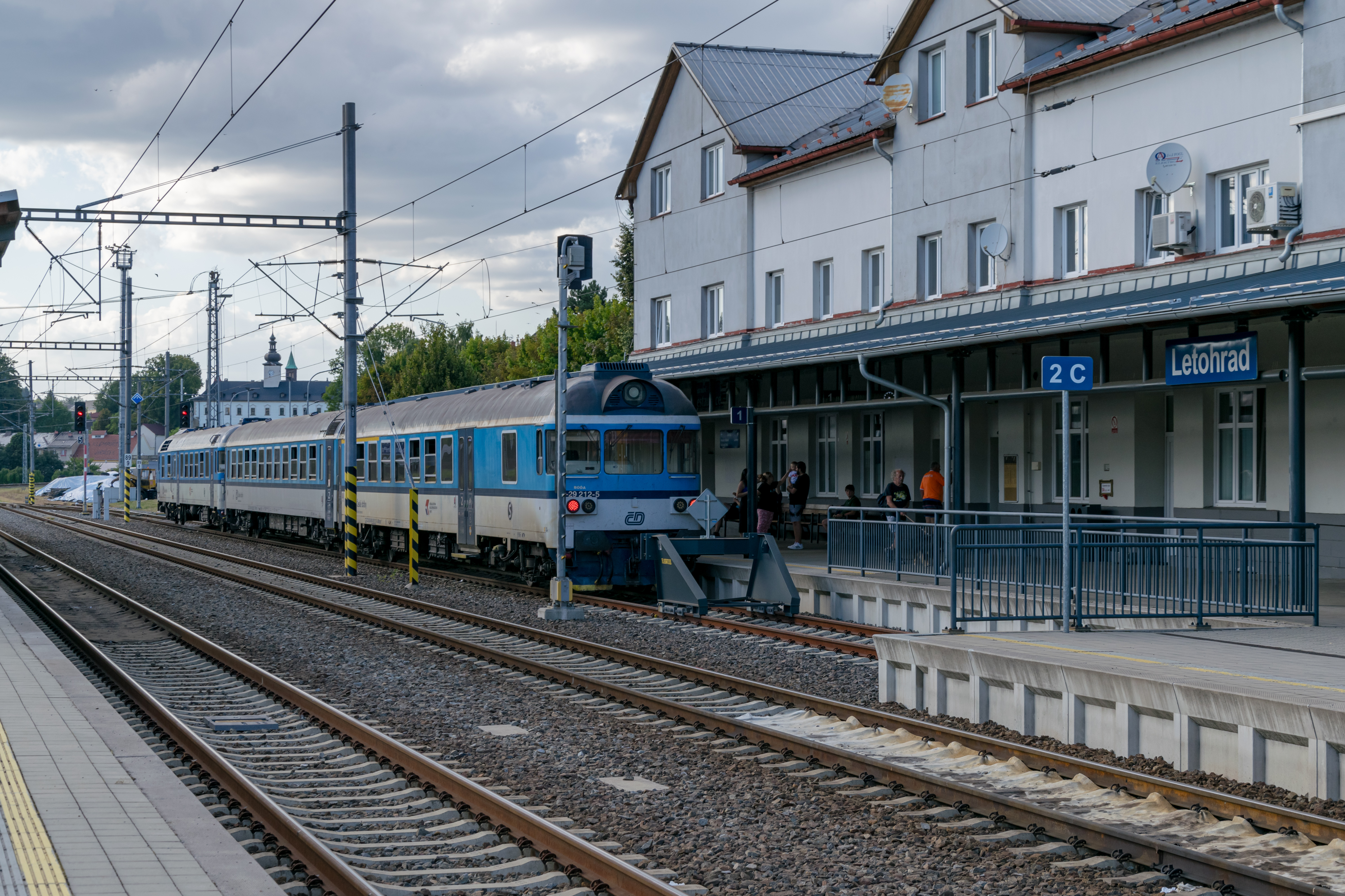 blue-white train waiting at a terminating track