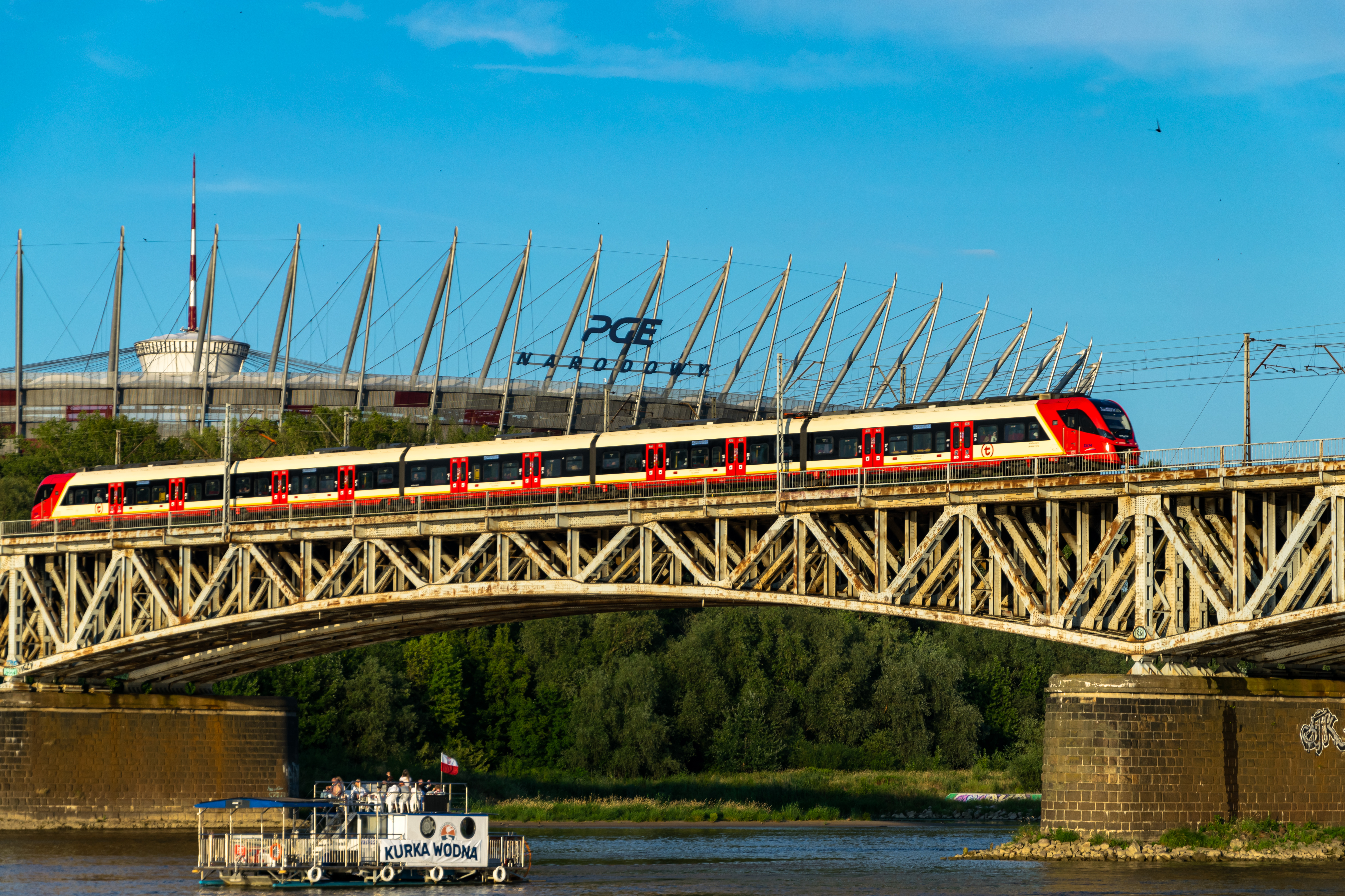 red-cream EMU on a bridge