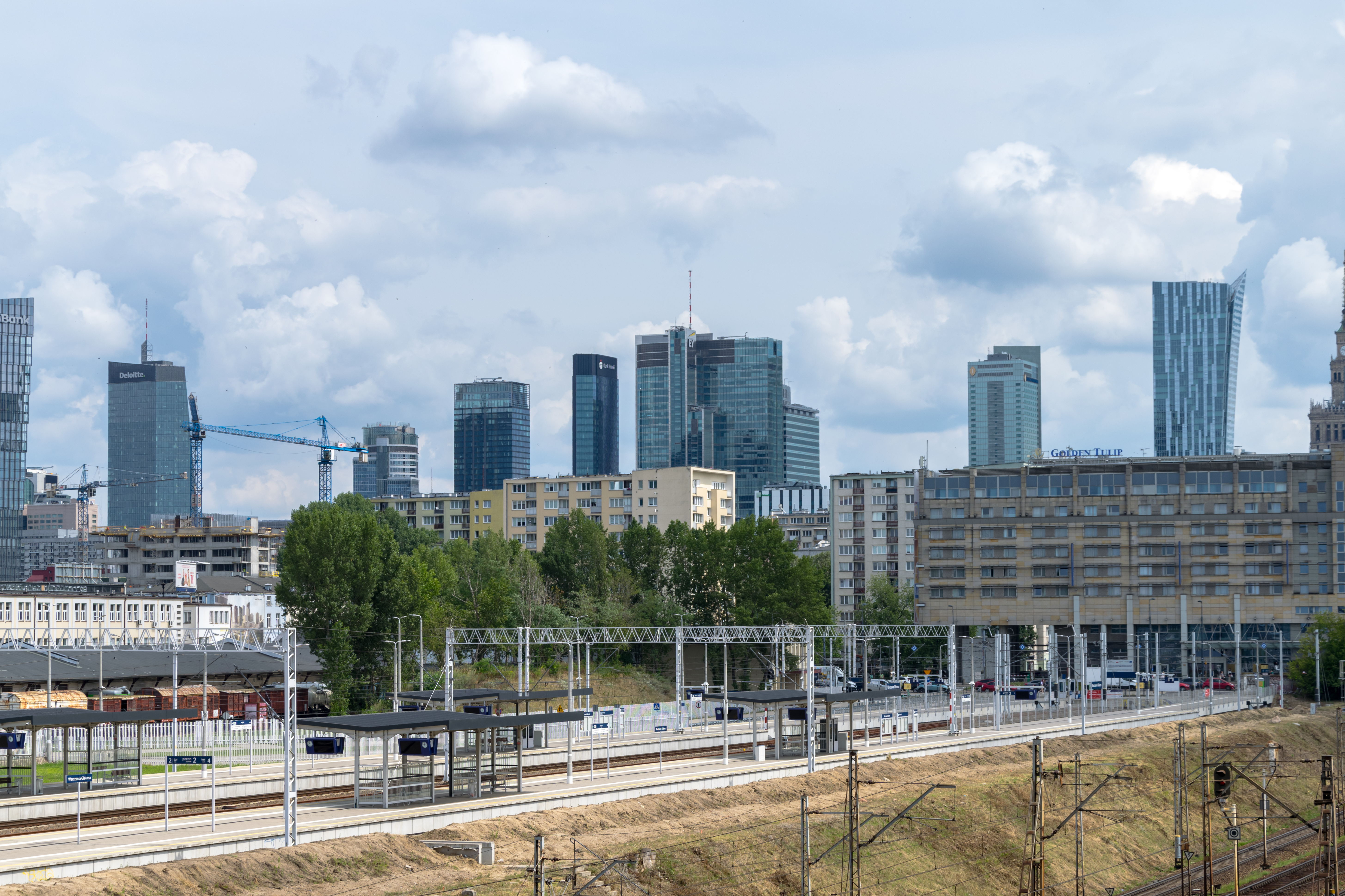 train station with skyscrapers behind
