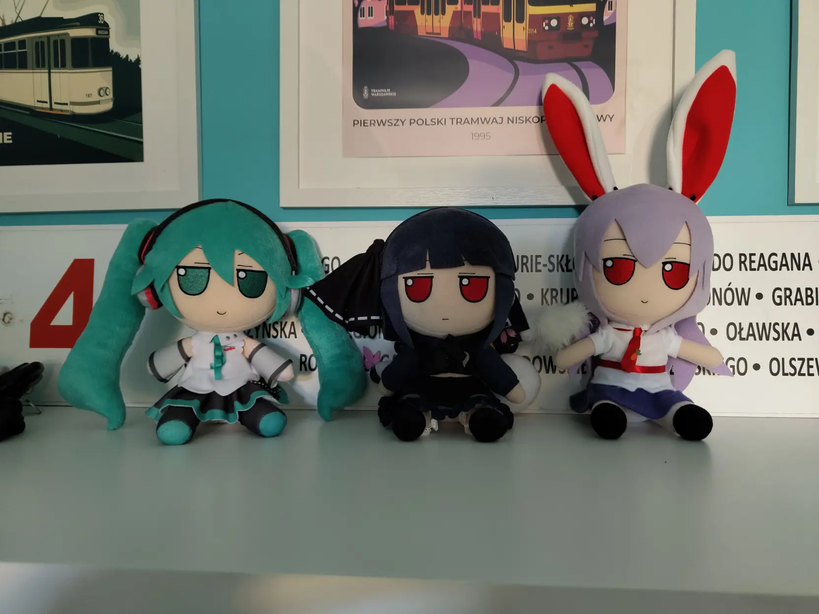 photo of three fumo plushies: Miku, Black Youmu and Udonge looking at viewer judgefully