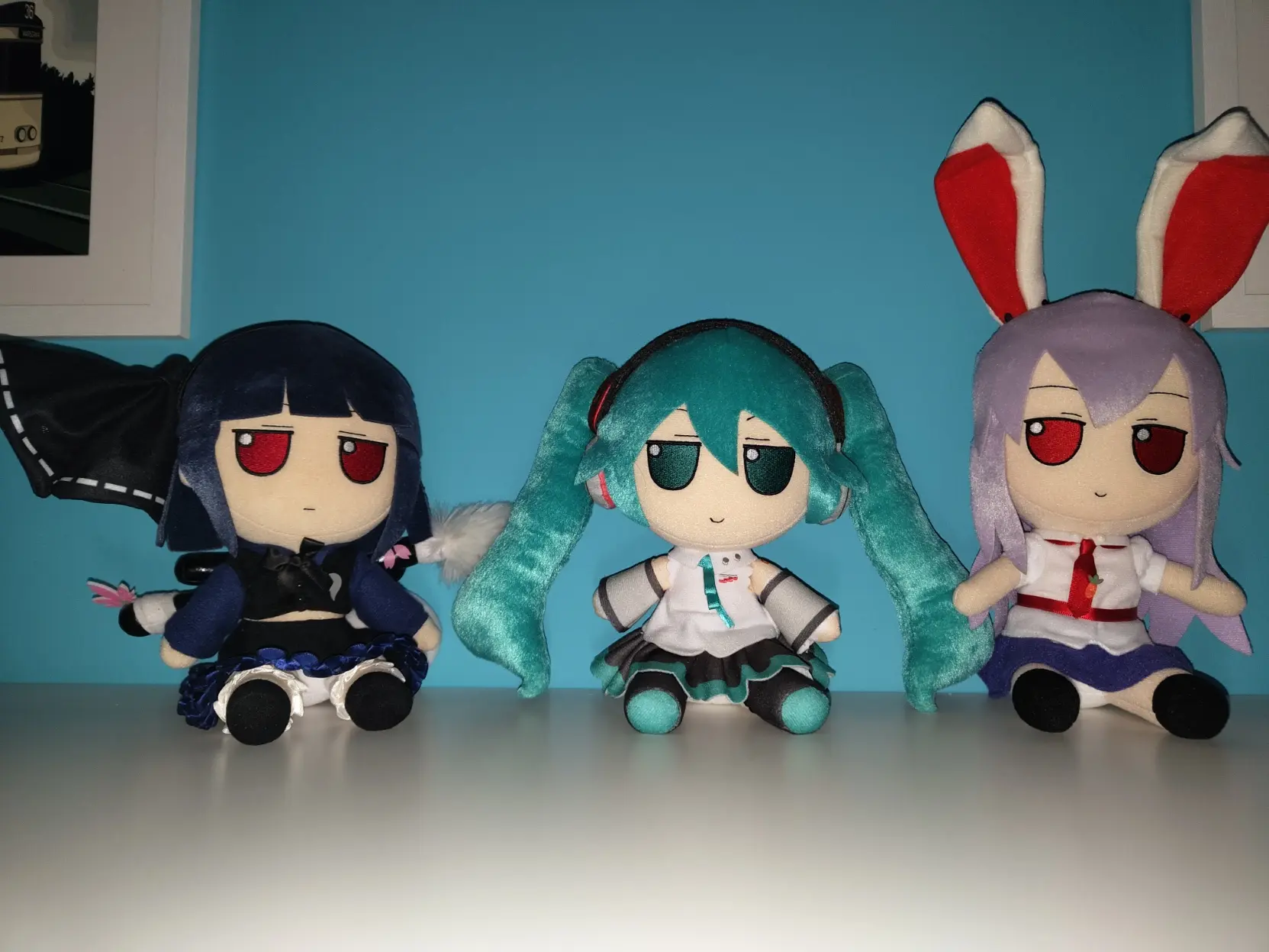 three fumo standing