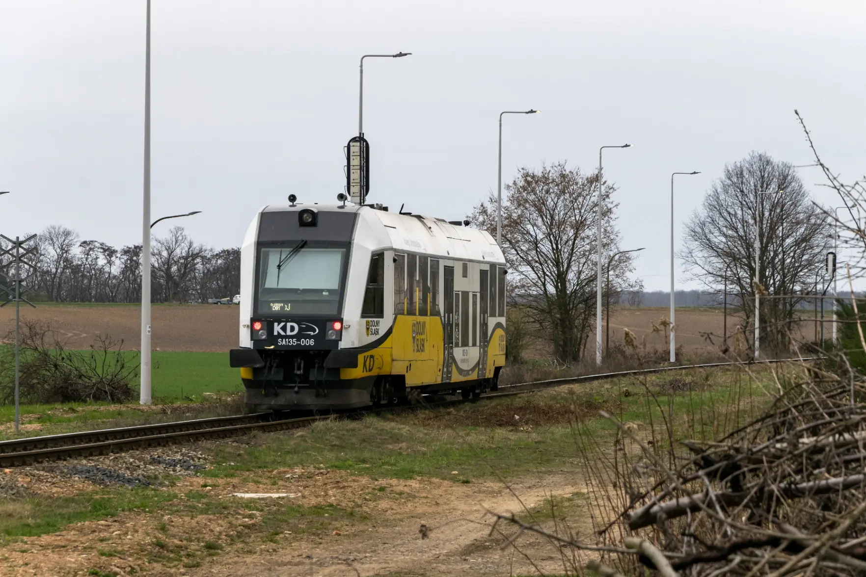 white-black-yellow motor car going past