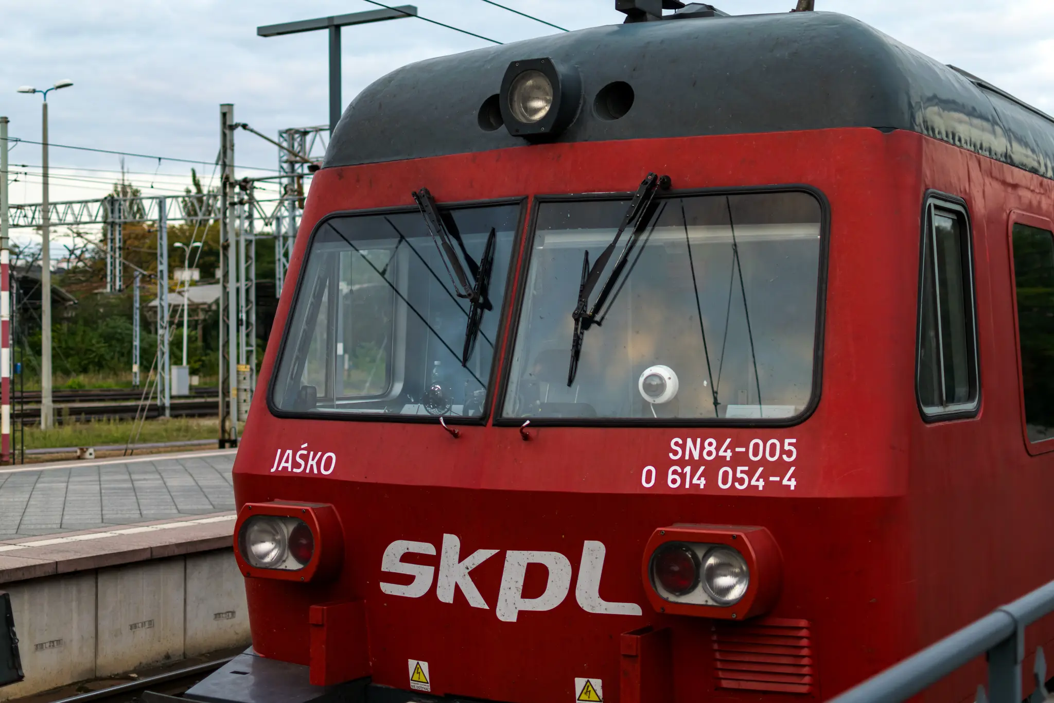 Red SKPL SN84, ex German BR614, stabled at a side track in Wrocław Główny