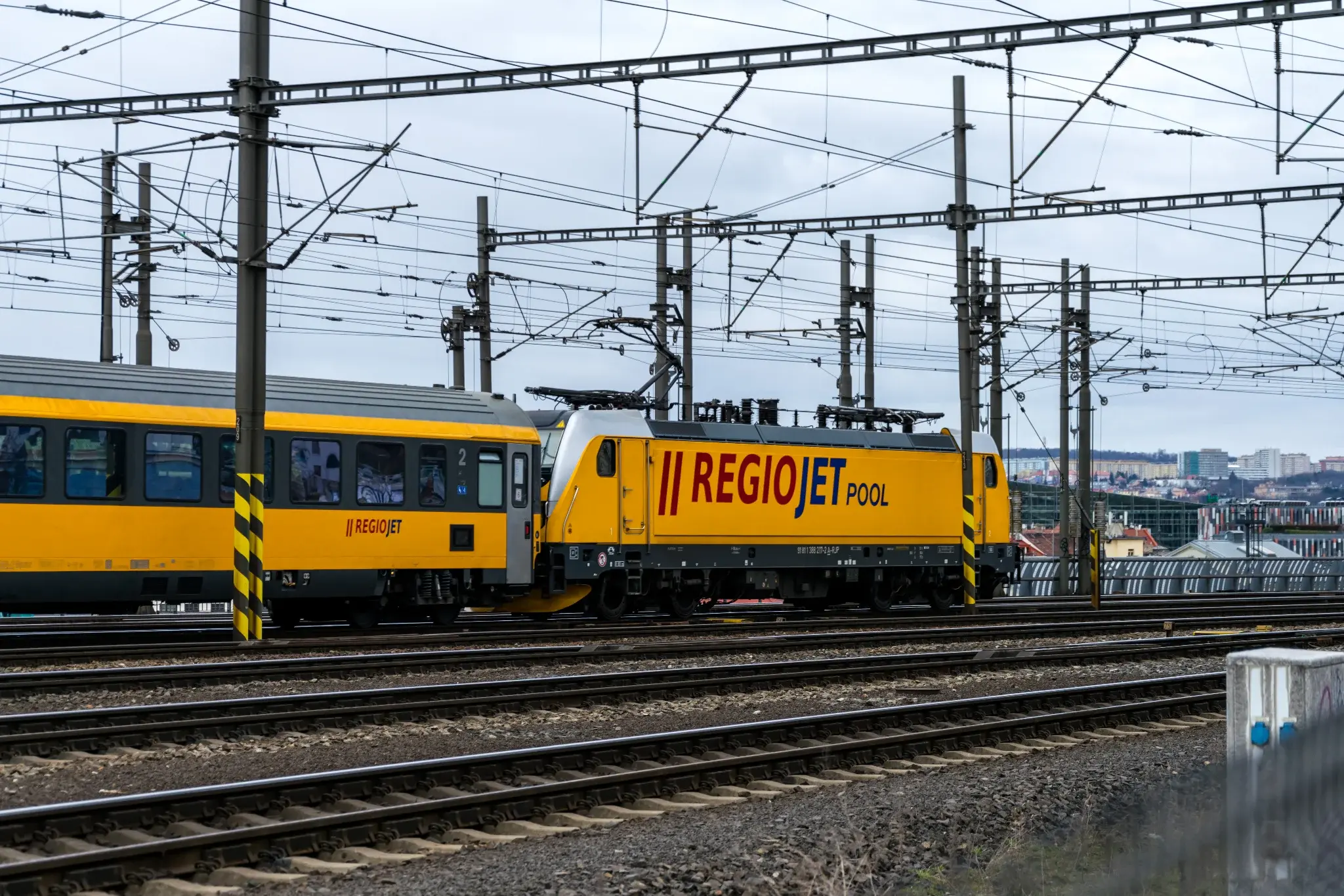 yellow locomotive with yellow coaches