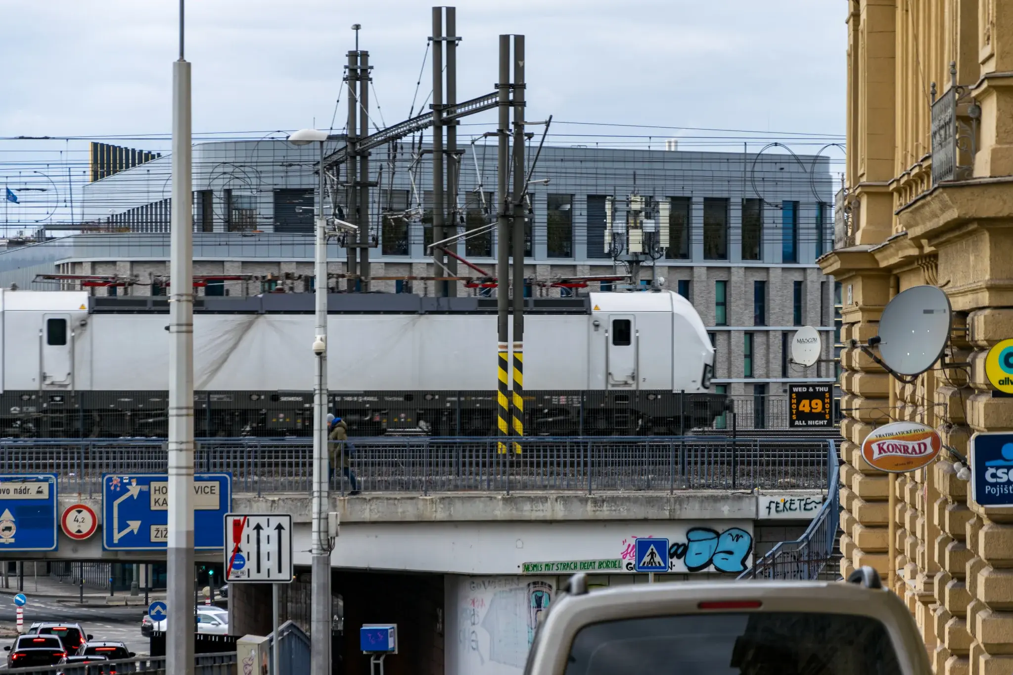 white vectron leaving the station, viewed from the street