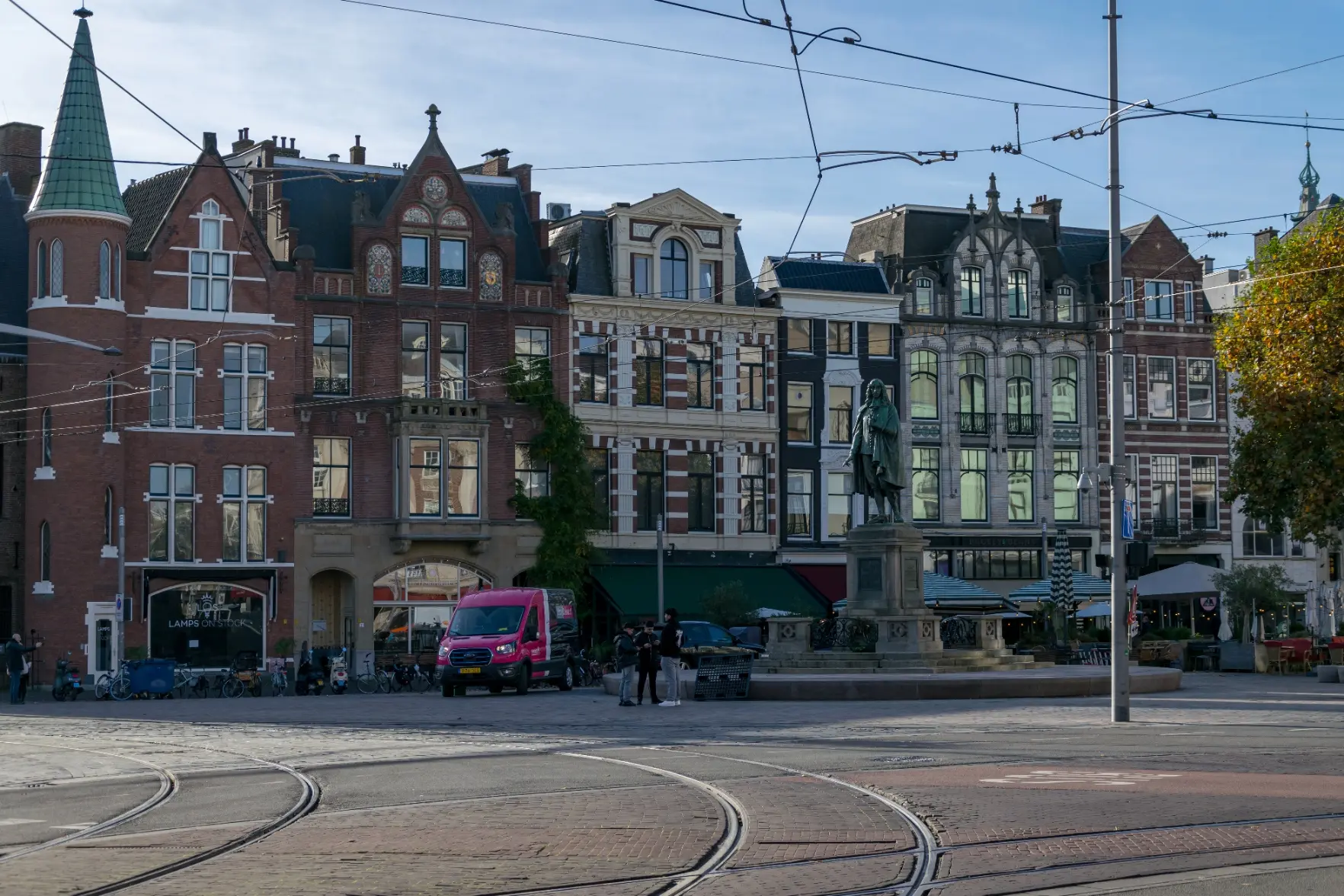colorful-ish buildings near a tram junction