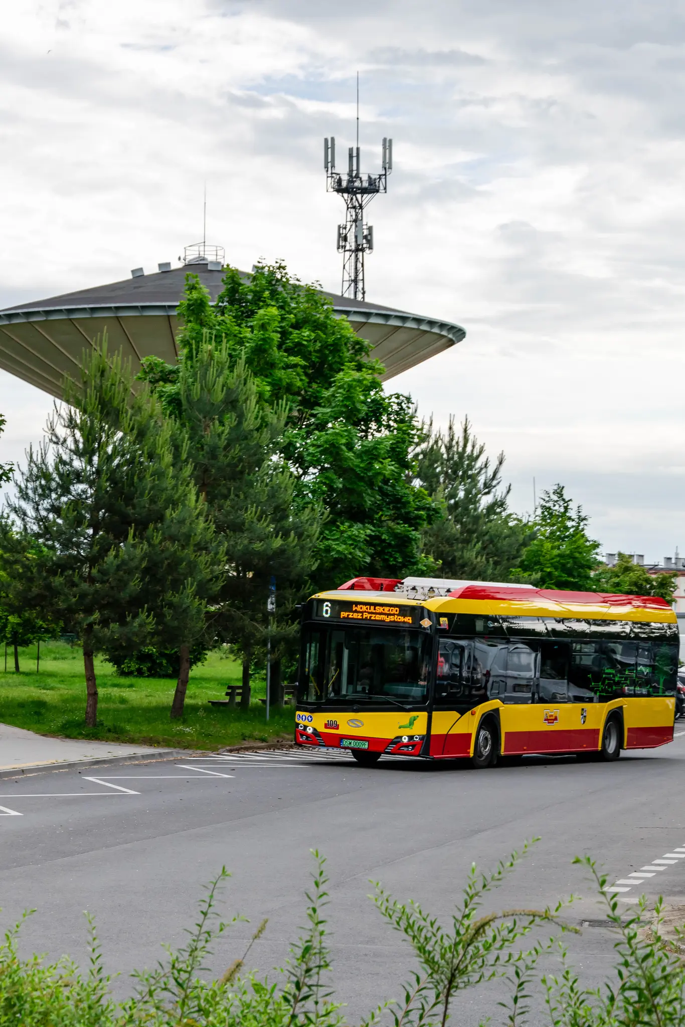same bus but it's enroute, next to a UFO-looking water tower