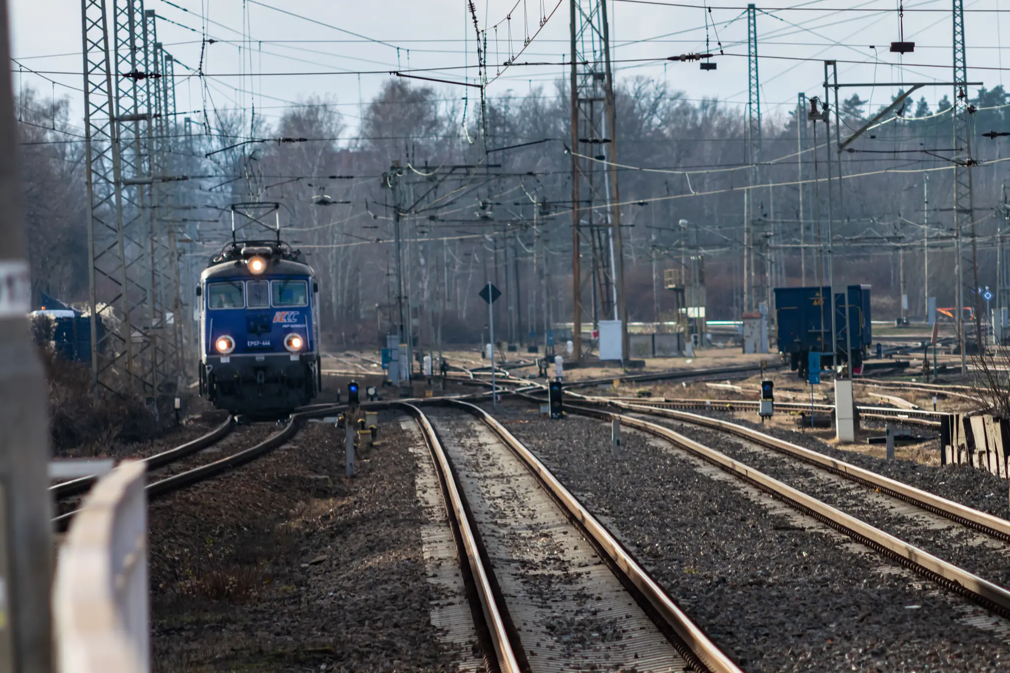 Old blue electric locomotive entering the station