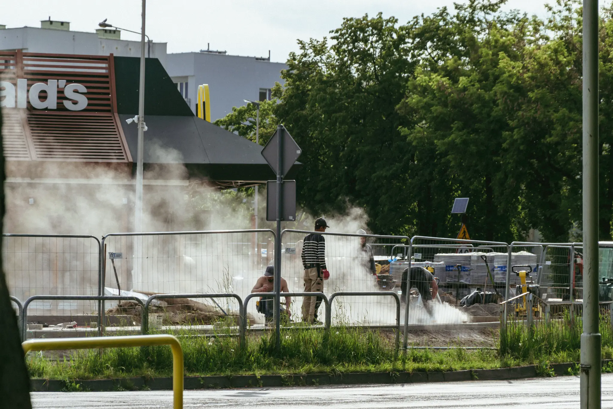 Builders next to McDonalds restaurant doing Stuff, there’s a lot of dust